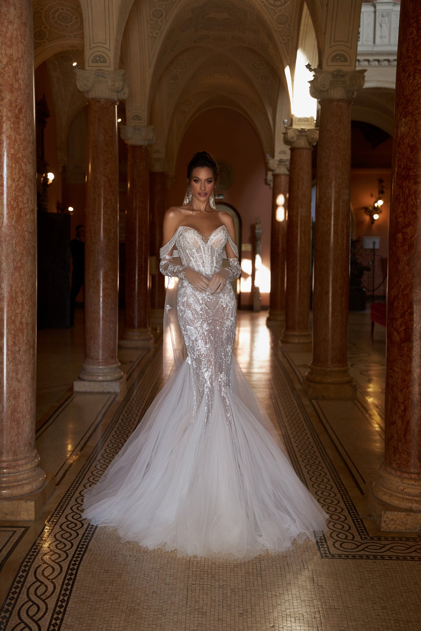 Mermaid lace wedding dress with godet skirt and open back.