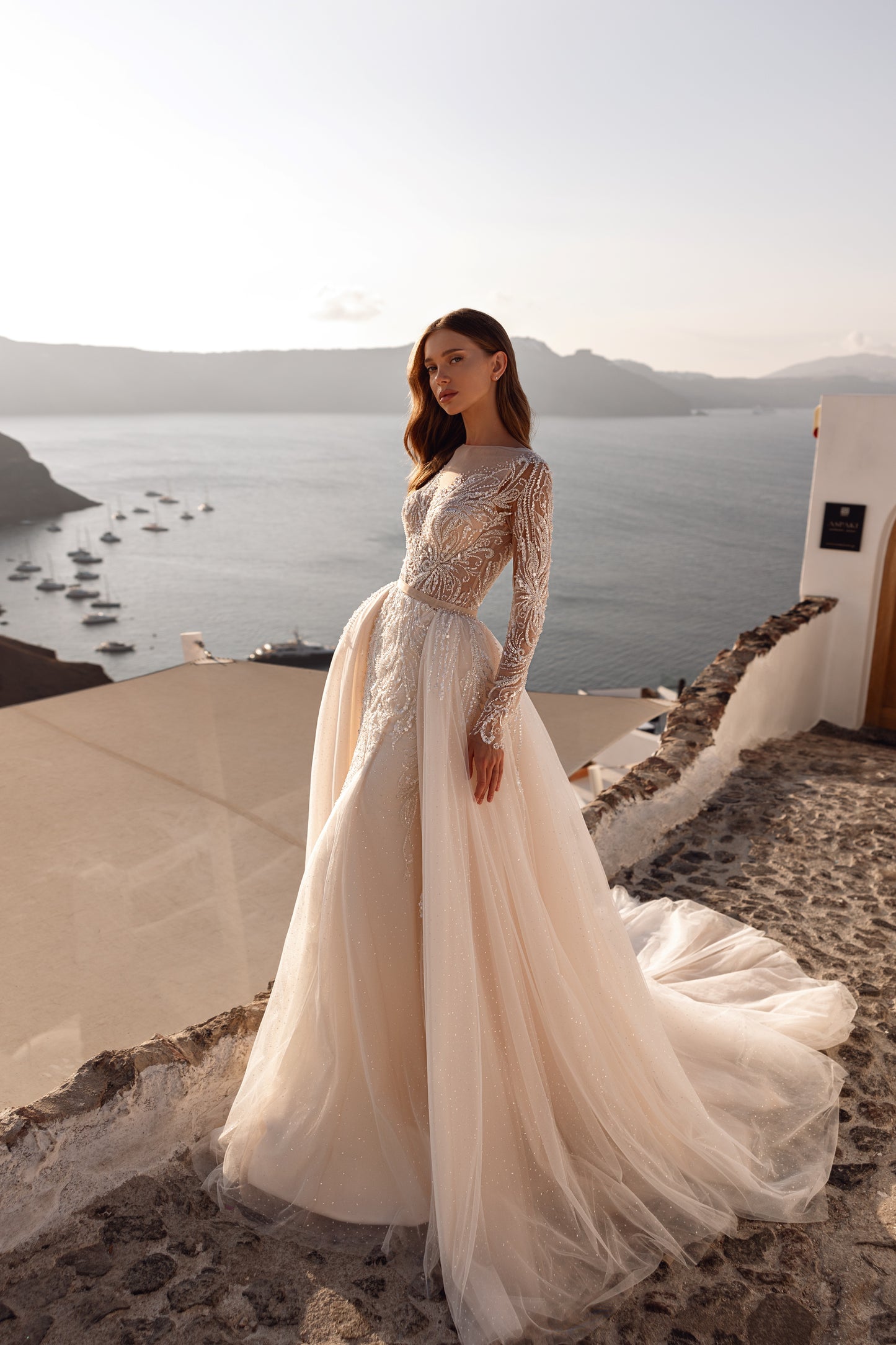 Fit and flare mermaid wedding dress with lace and long sleeves