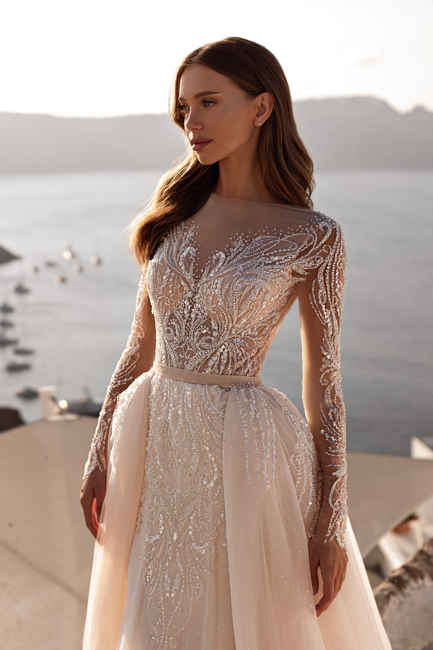 Fit and flare mermaid wedding dress with lace and long sleeves