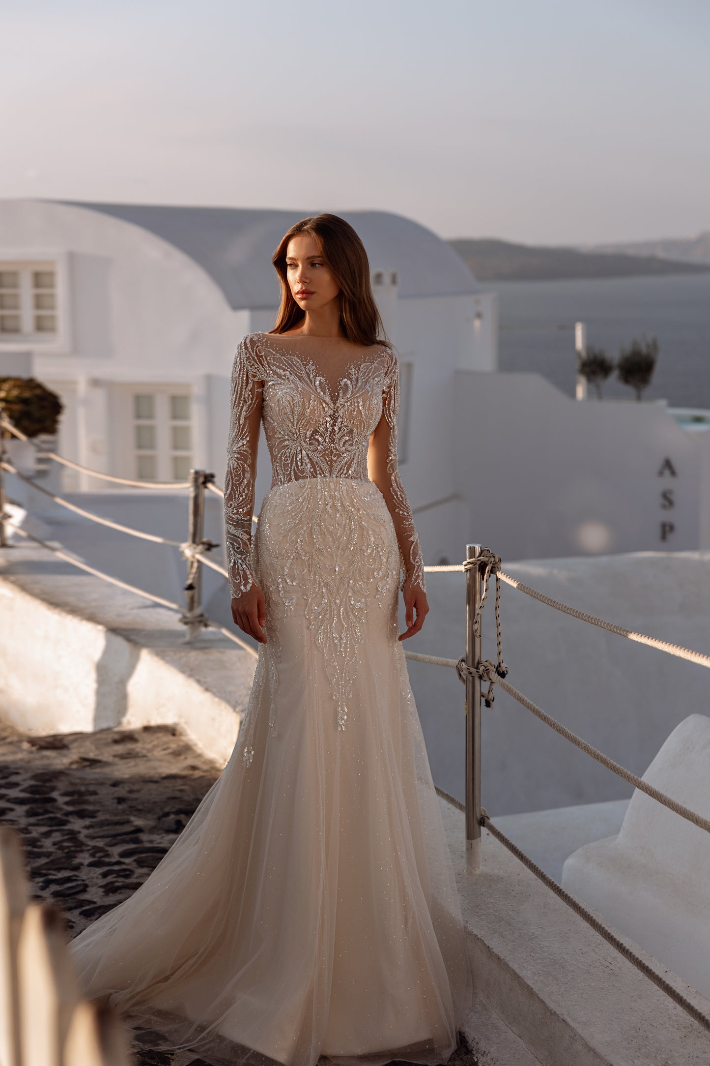 Fit and flare mermaid wedding dress with lace and long sleeves