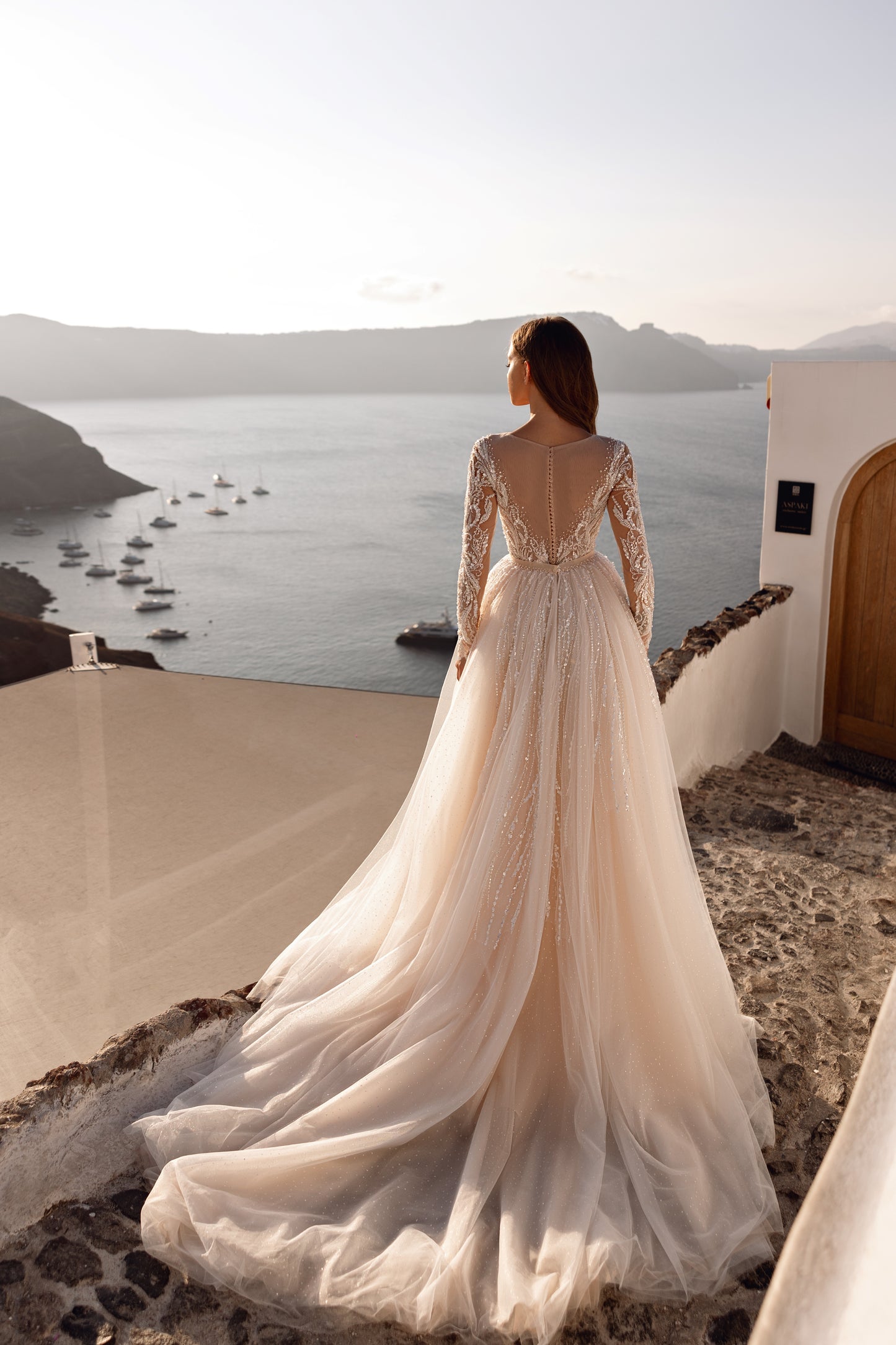 Fit and flare mermaid wedding dress with lace and long sleeves