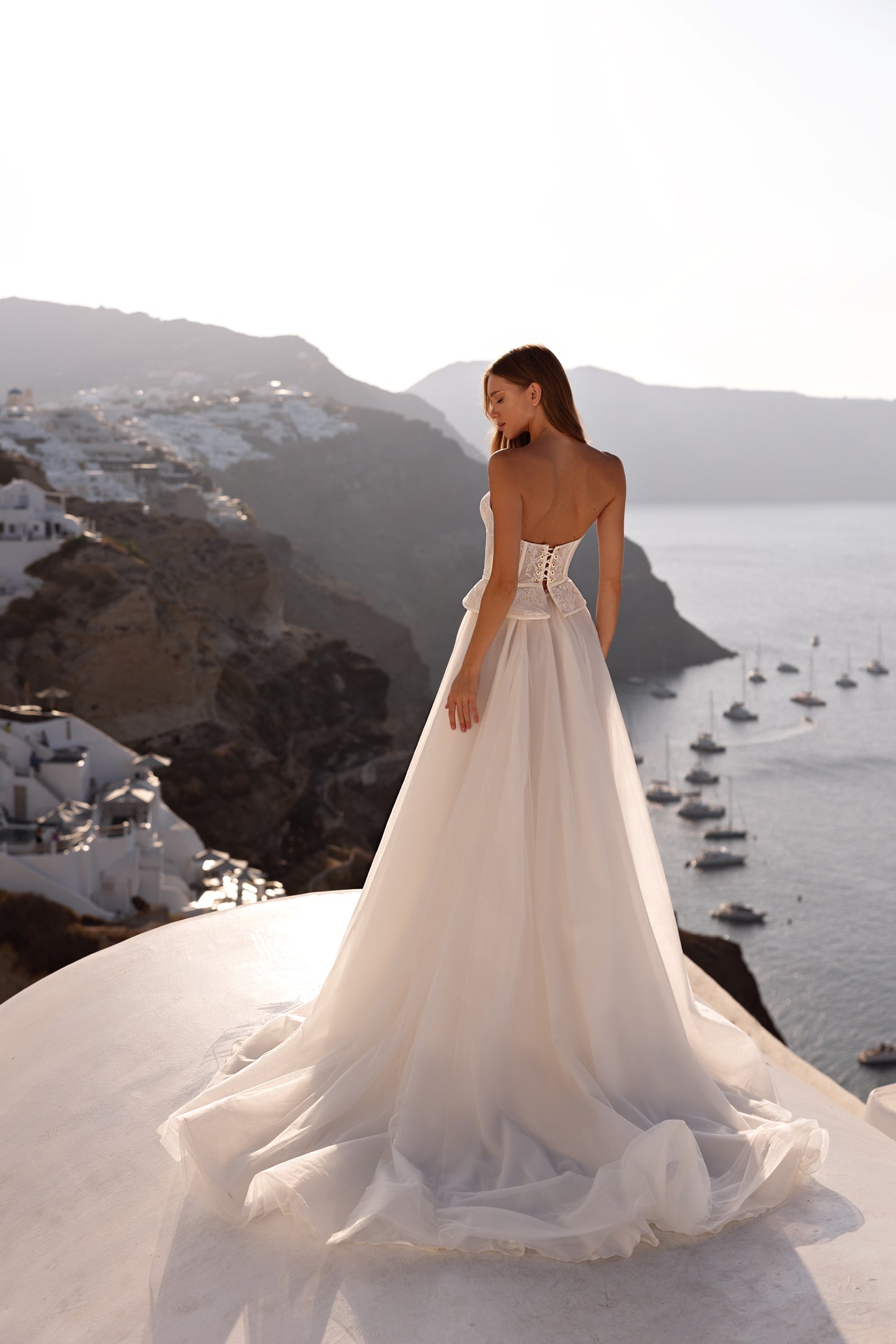 Strapless A-line wedding dress with lace corset and slit.