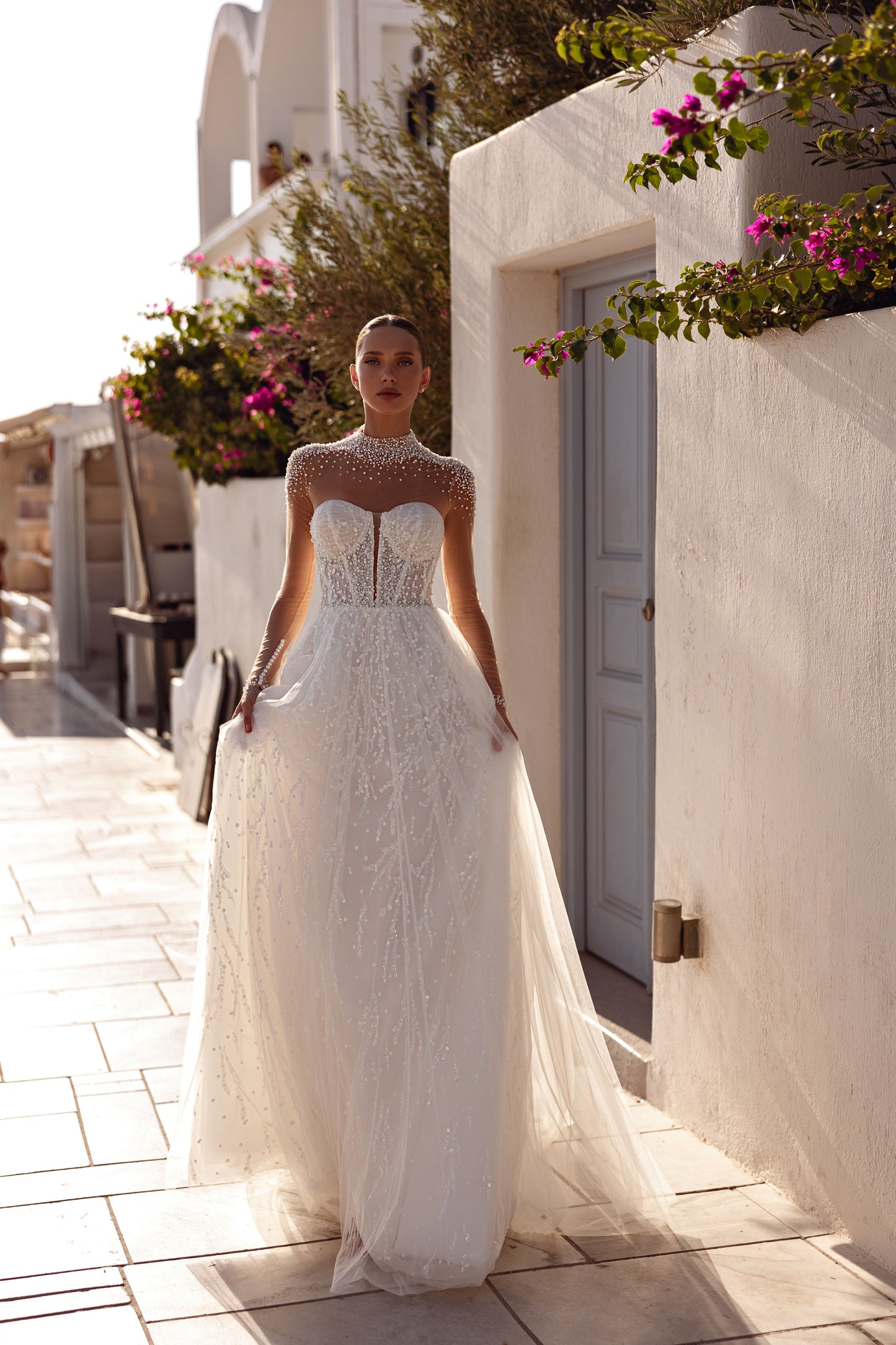 A-line halter wedding dress with pearl embellished bodice.
