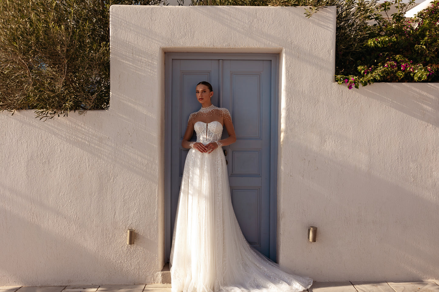 A-line halter wedding dress with pearl embellished bodice.