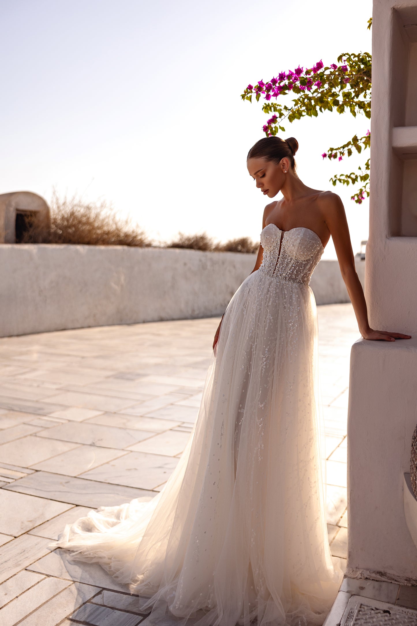 A-line halter wedding dress with pearl embellished bodice.