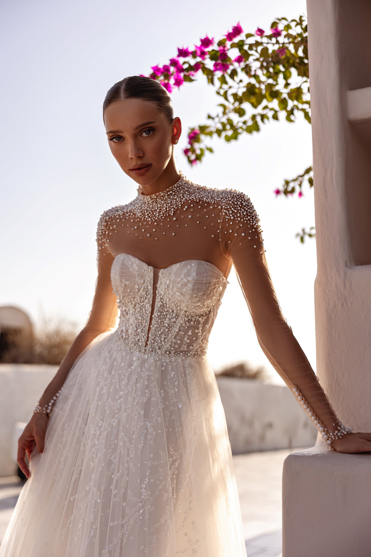 A-line halter wedding dress with pearl embellished bodice.