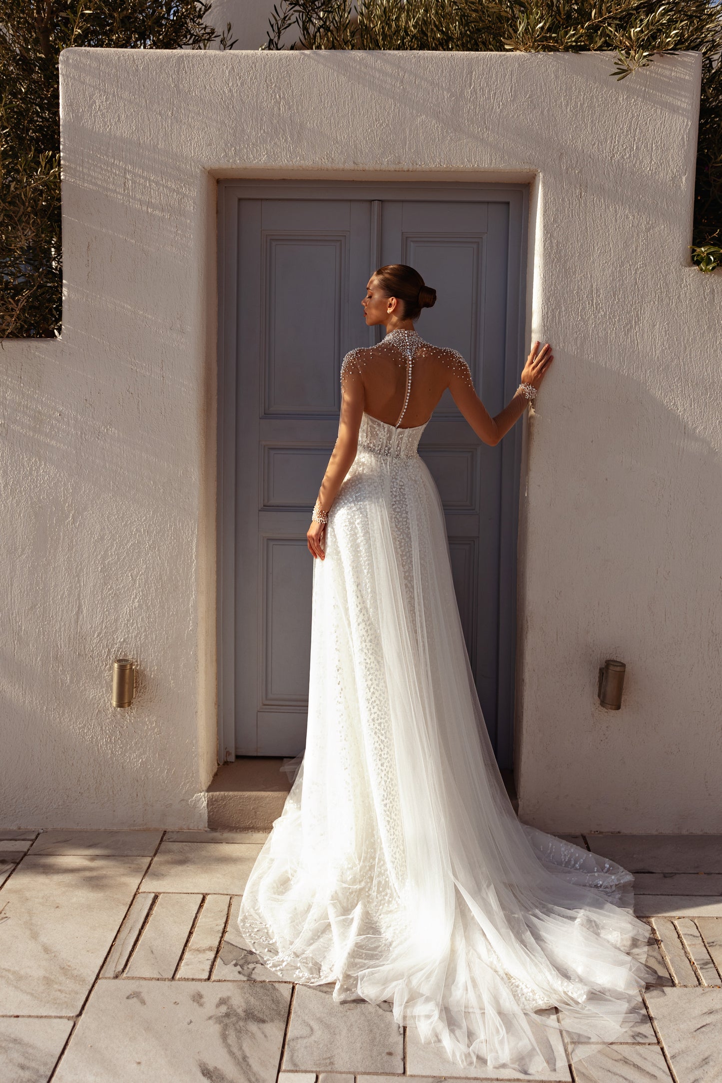 A-line halter wedding dress with pearl embellished bodice.