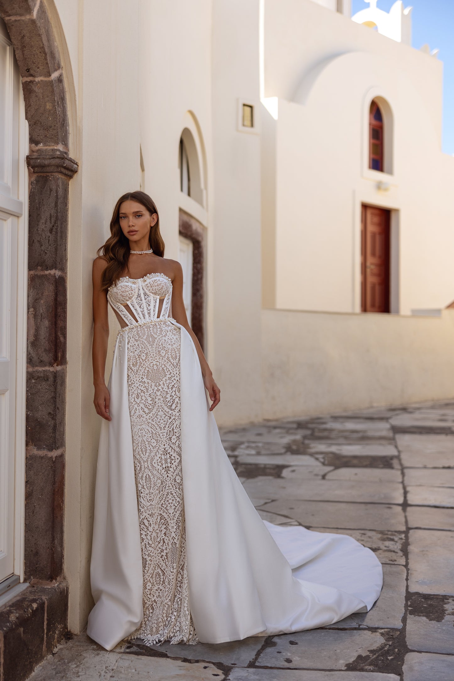 Mermaid fit-and-flare wedding dress with long sleeves and lace
