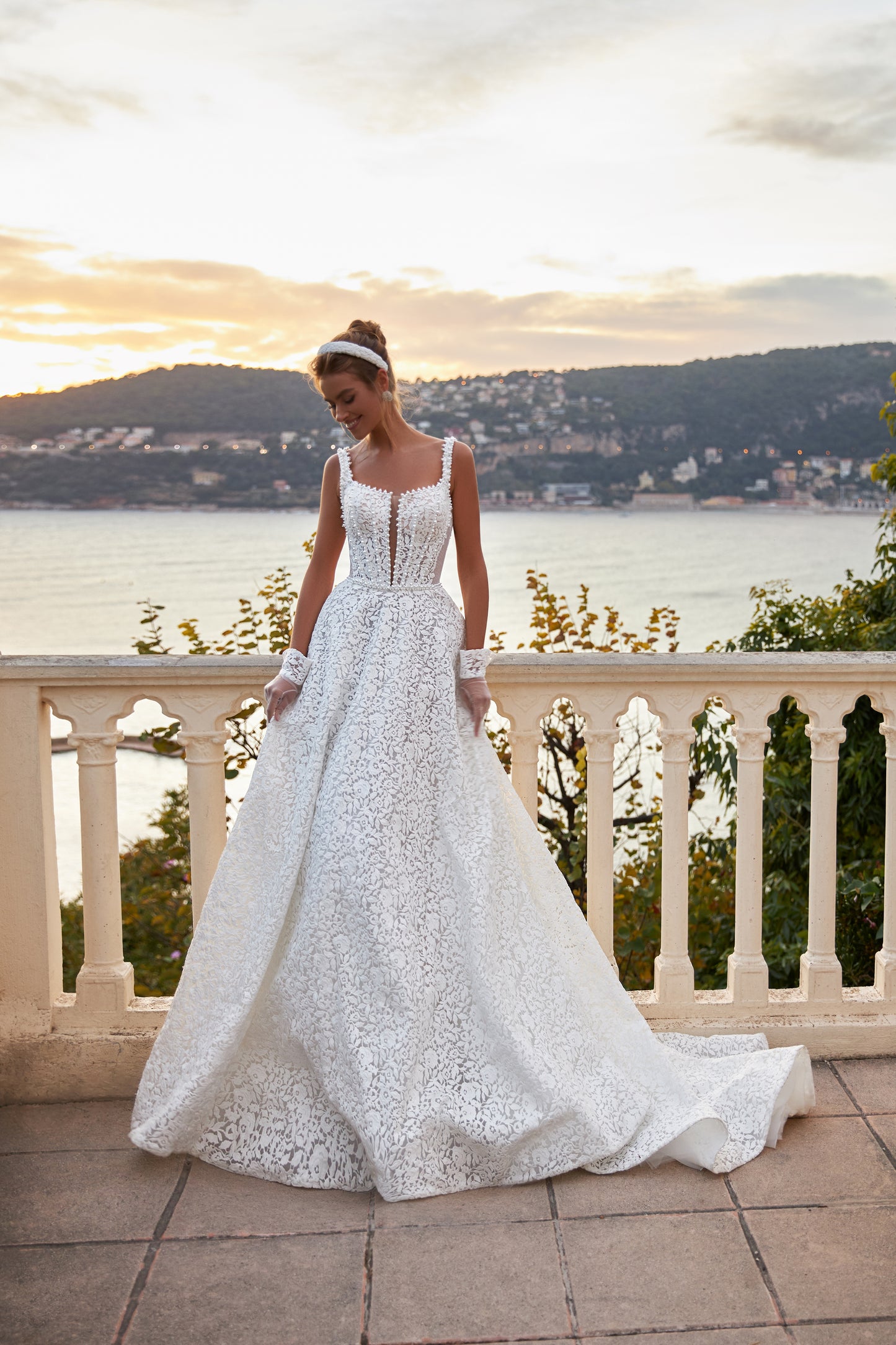 A-line ivory wedding dress with lace and halter neckline.
