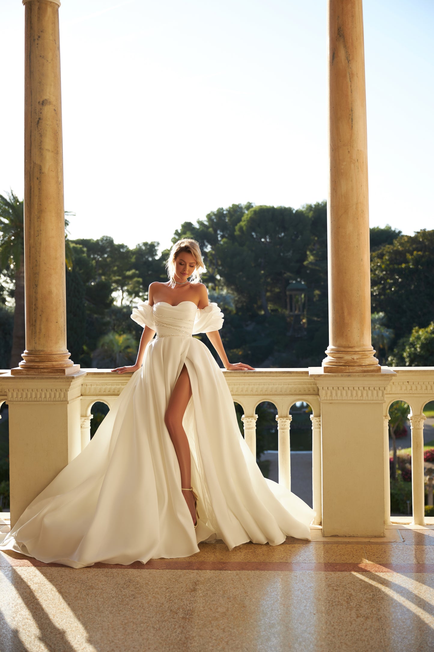 Sweetheart neckline satin organza wedding dress with slit.