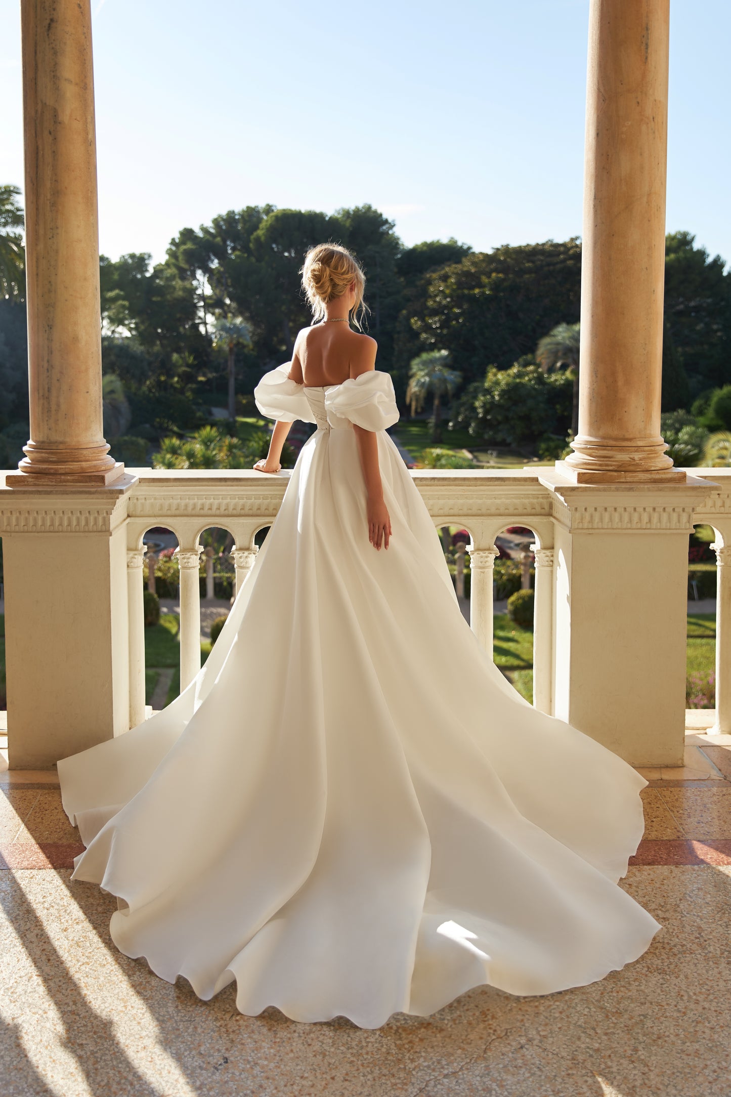 Sweetheart neckline satin organza wedding dress with slit.