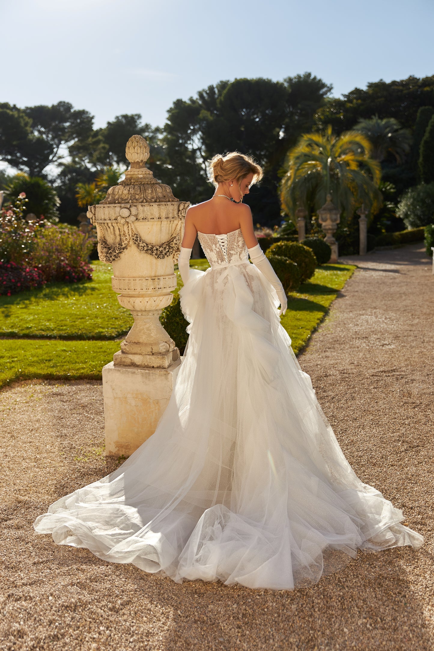Fitted mermaid wedding dress with lace and open back.