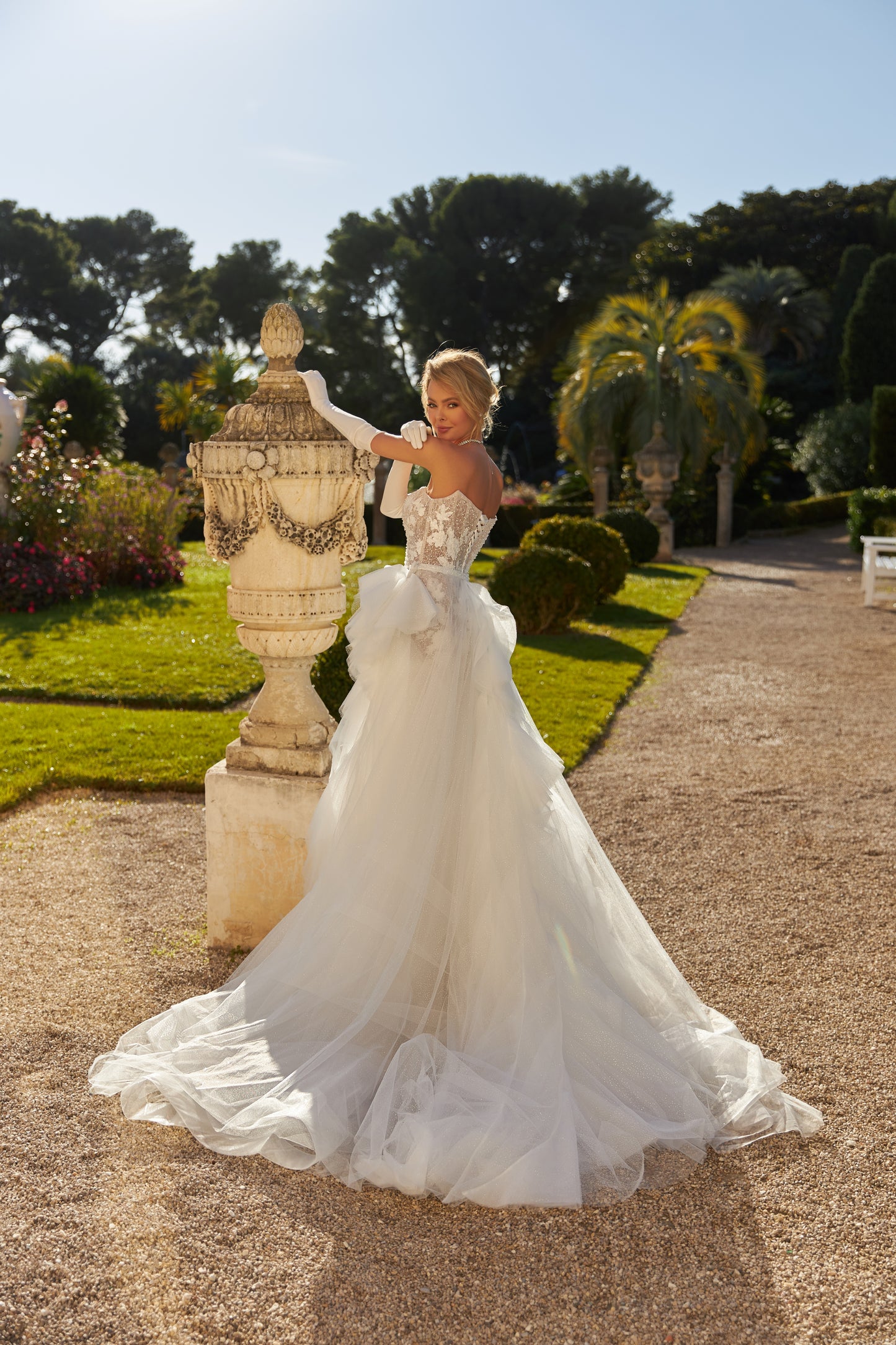 Fitted mermaid wedding dress with lace and open back.