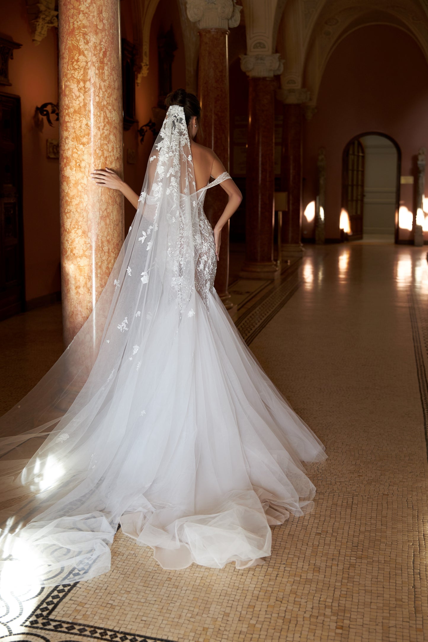 Mermaid lace wedding dress with godet skirt and open back.