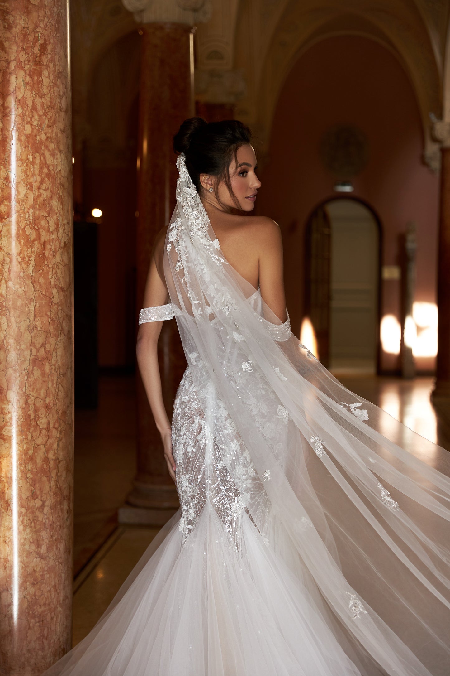 Mermaid lace wedding dress with godet skirt and open back.