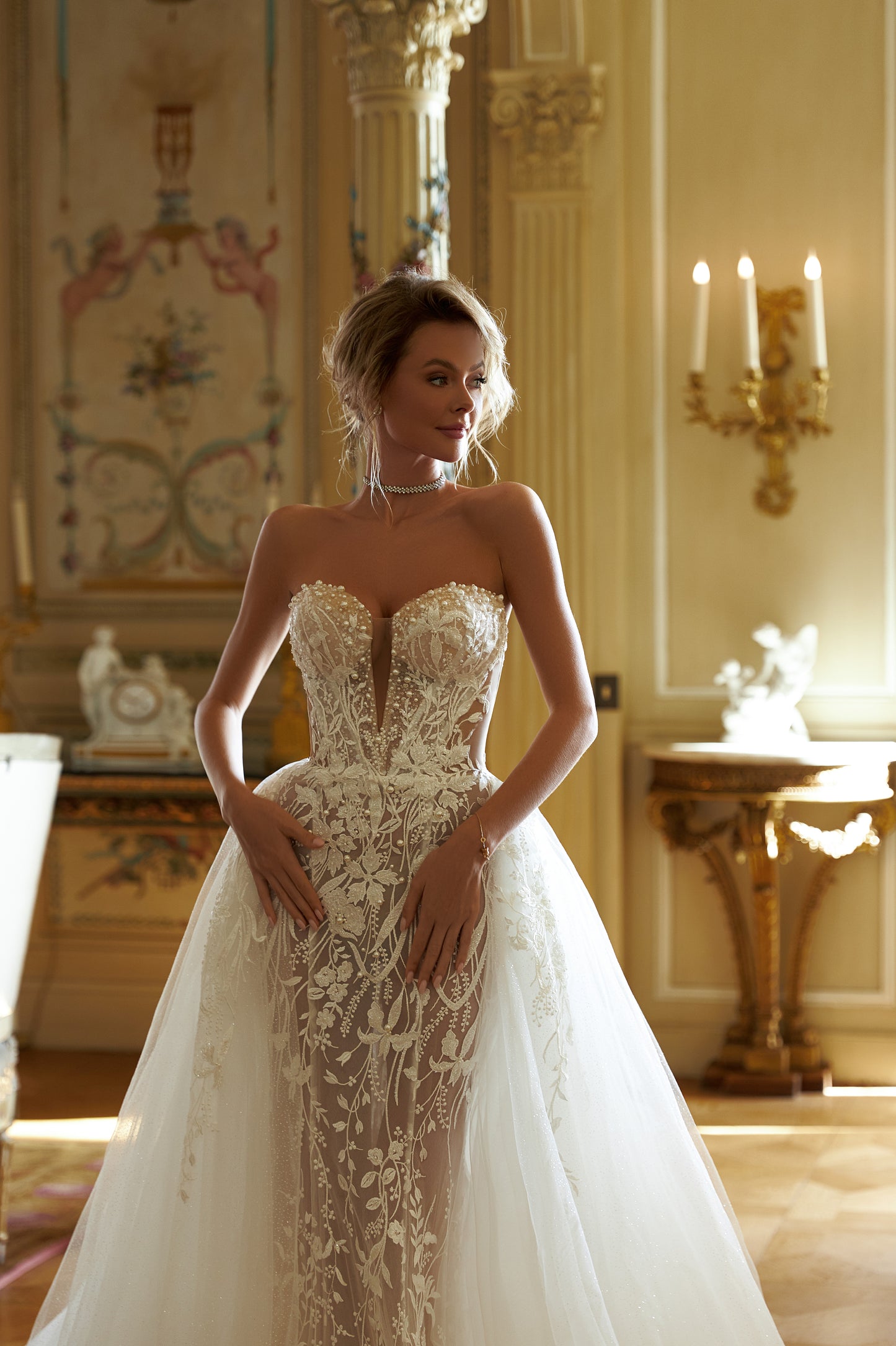 Fitted mermaid lace wedding dress with halter neckline.