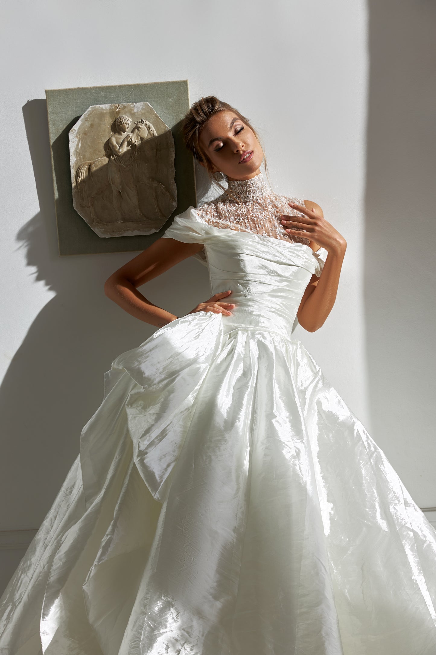 A-line silk wedding dress with off-the-shoulder sleeves
