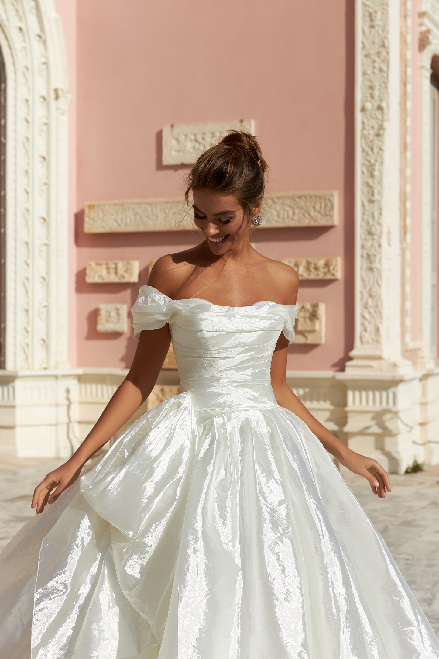 A-line silk wedding dress with off-the-shoulder sleeves