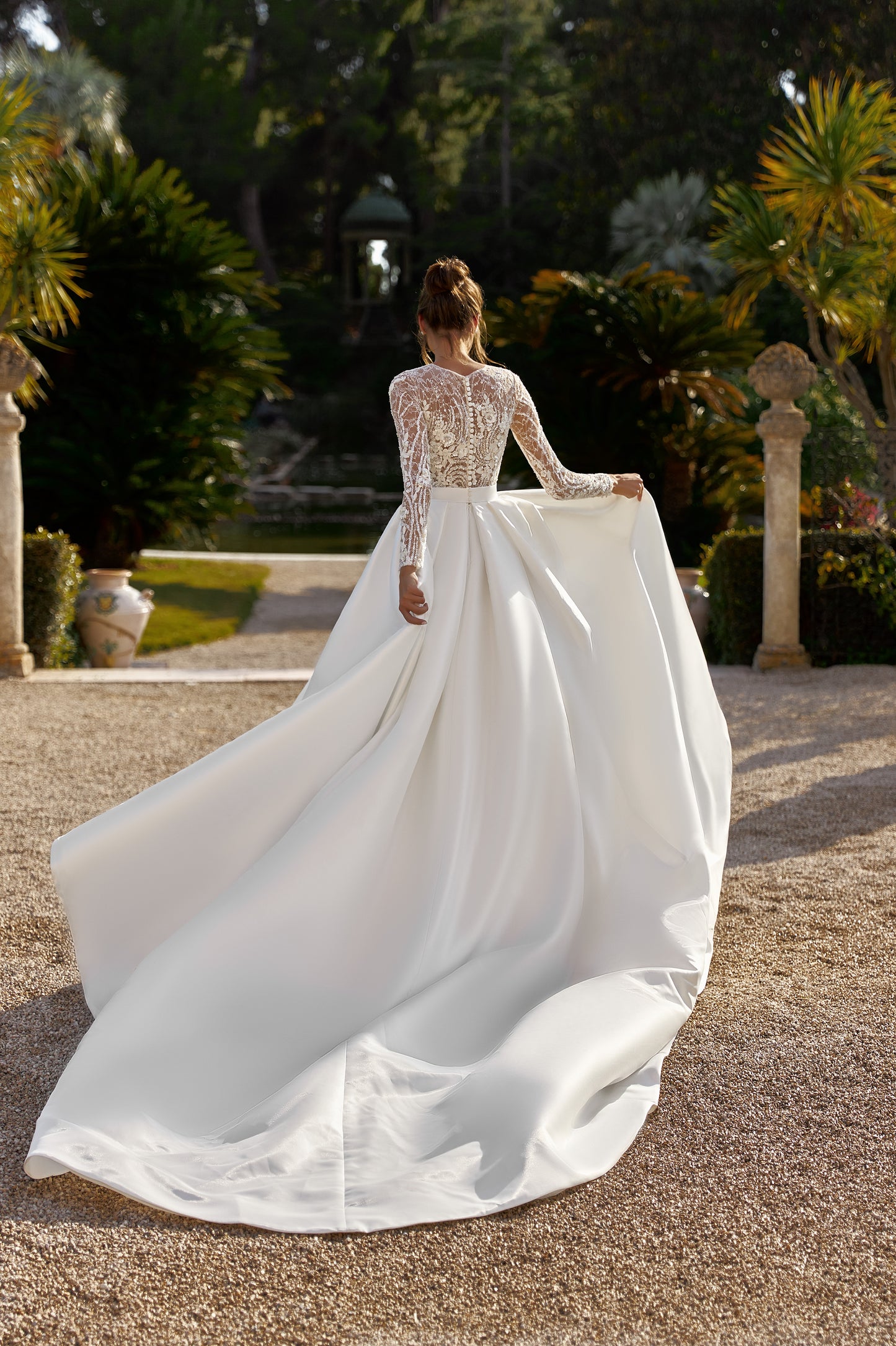 A-line long sleeve wedding dress with chapel train and lace.
