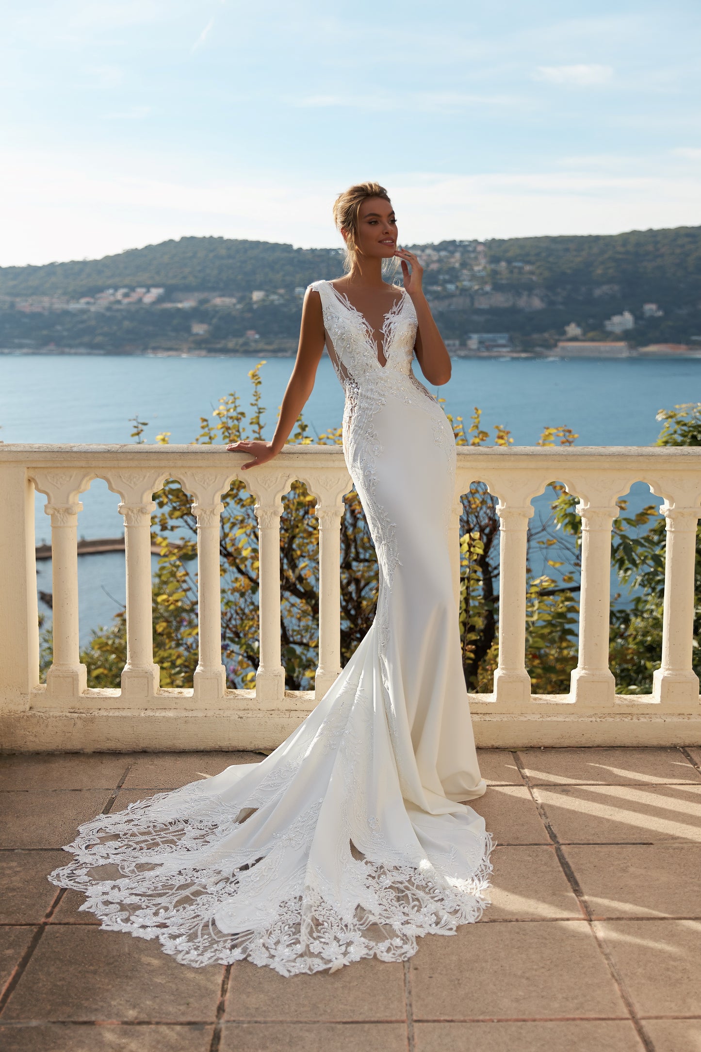Mermaid lace satin wedding dress with deep V neckline.