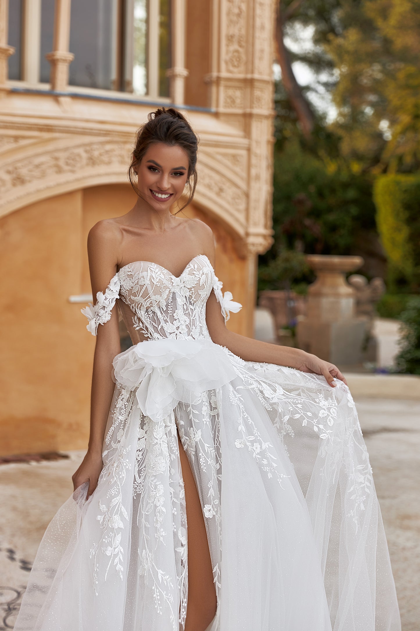 A-line glitter tulle wedding dress with slit and open back.