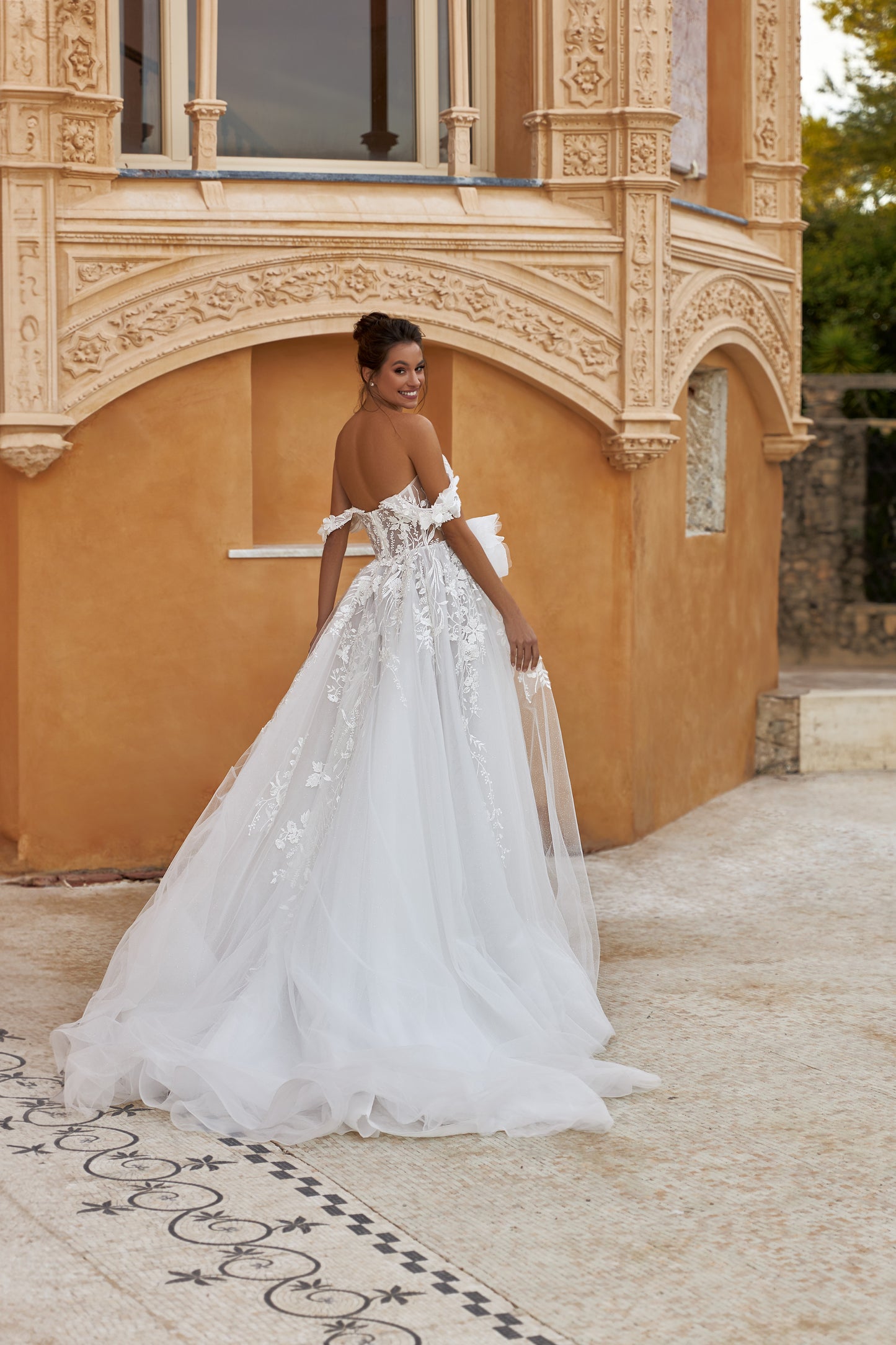 A-line glitter tulle wedding dress with slit and open back.