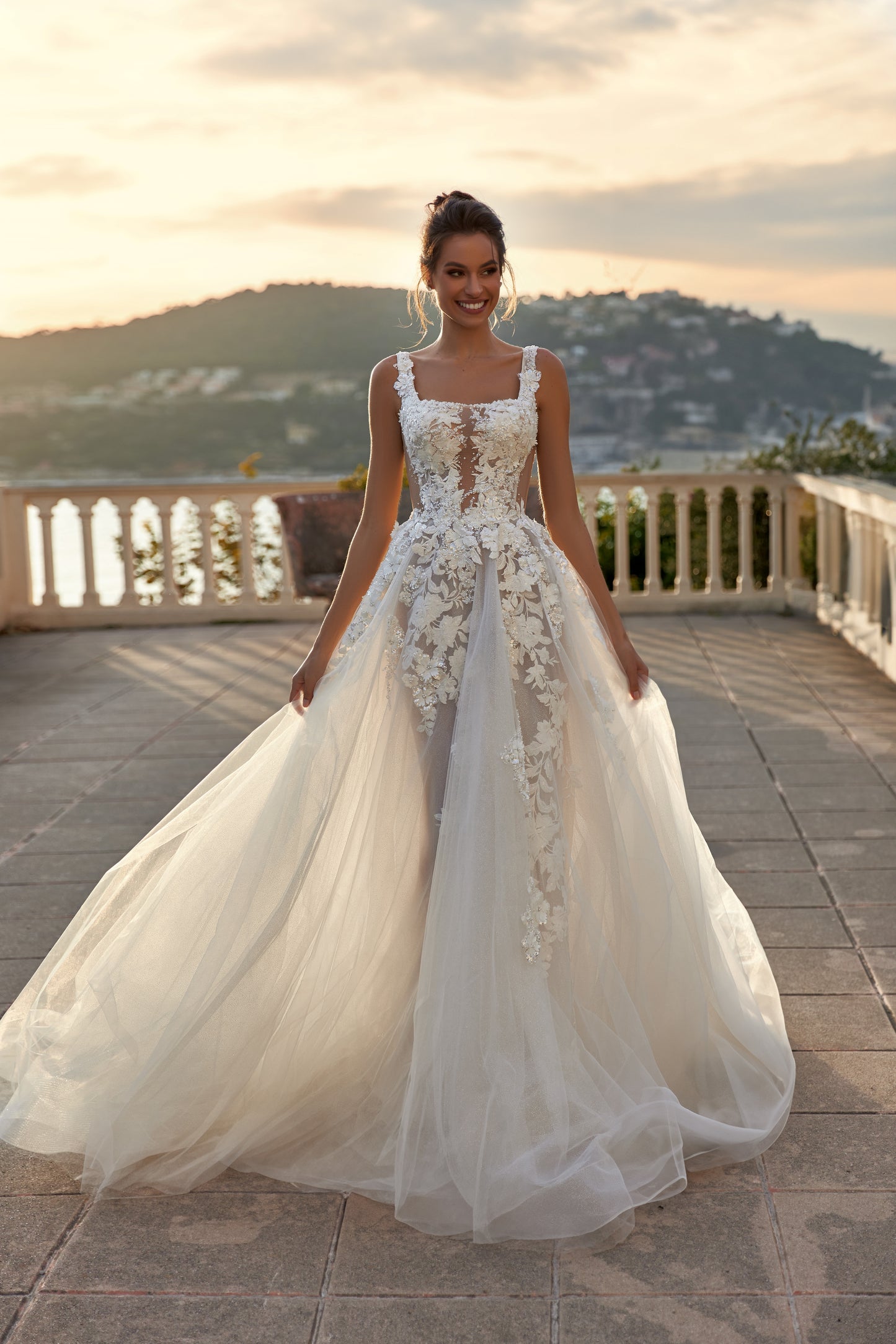 Ivory A-line tulle wedding dress with square neckline and lace.