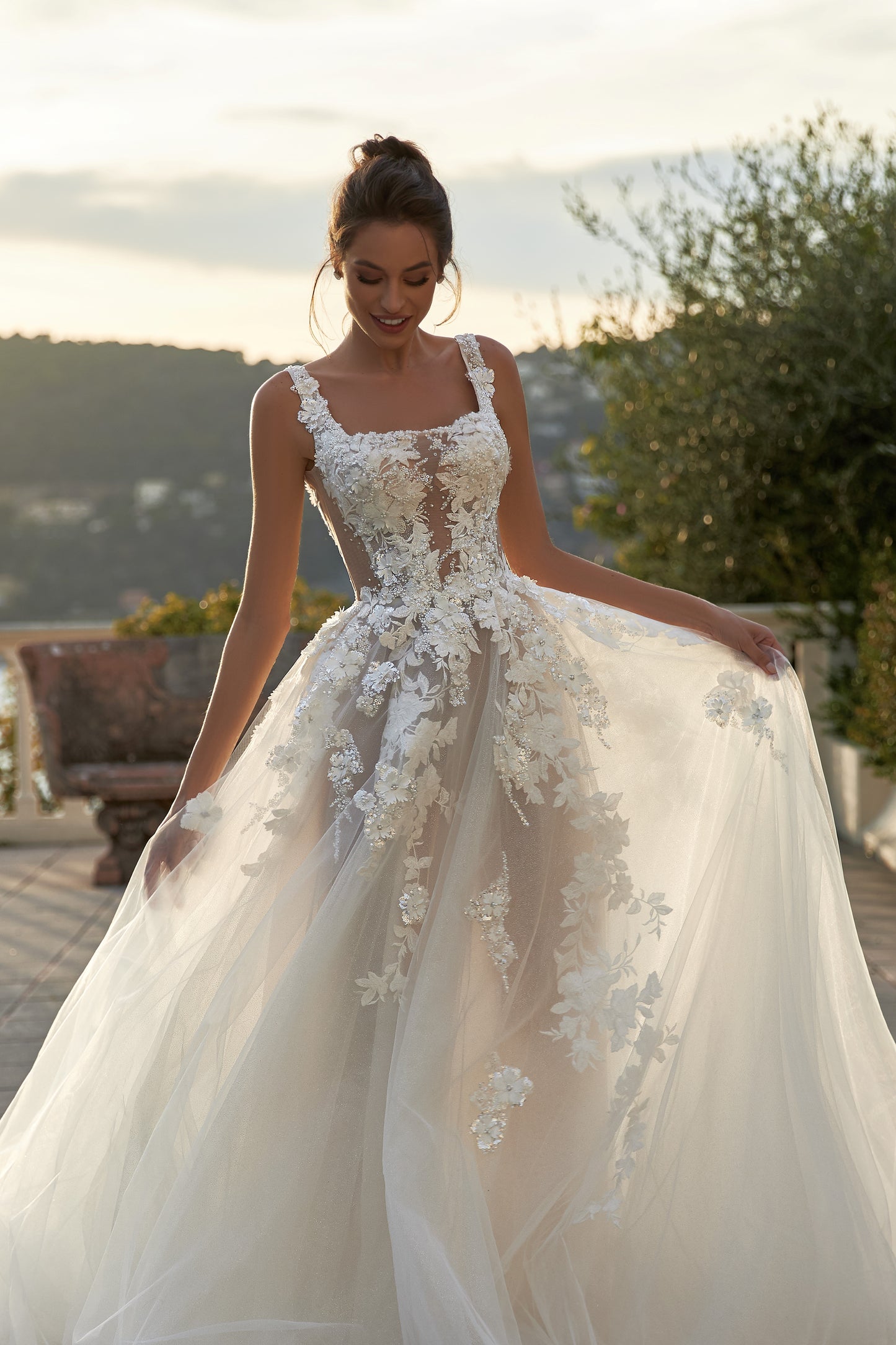 Ivory A-line tulle wedding dress with square neckline and lace.