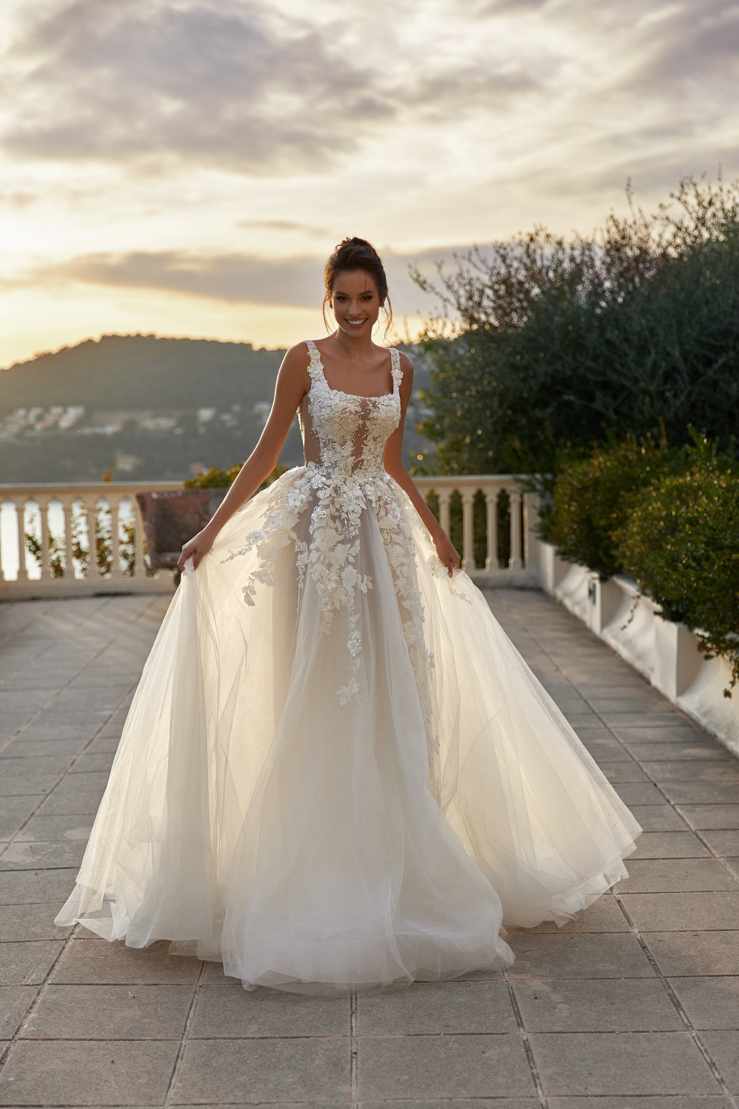 Ivory A-line tulle wedding dress with square neckline and lace.