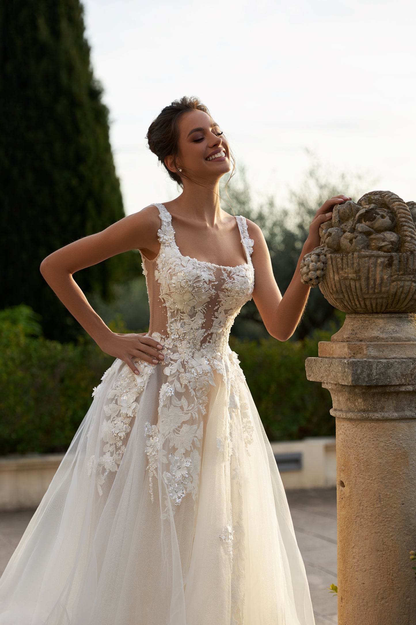Ivory A-line tulle wedding dress with square neckline and lace.