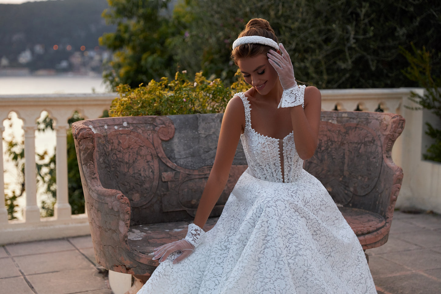 A-line ivory wedding dress with lace and halter neckline.