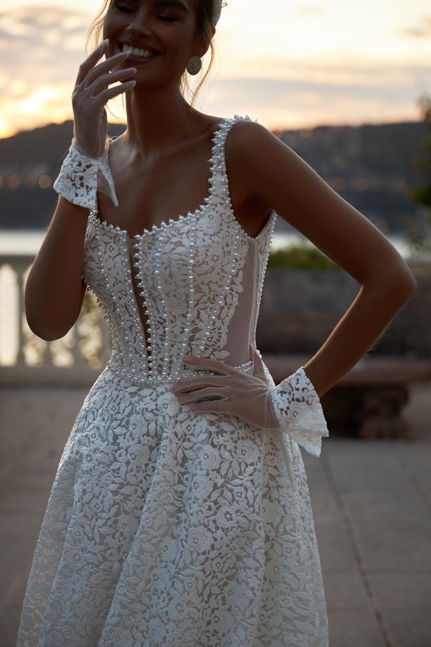 A-line ivory wedding dress with lace and halter neckline.