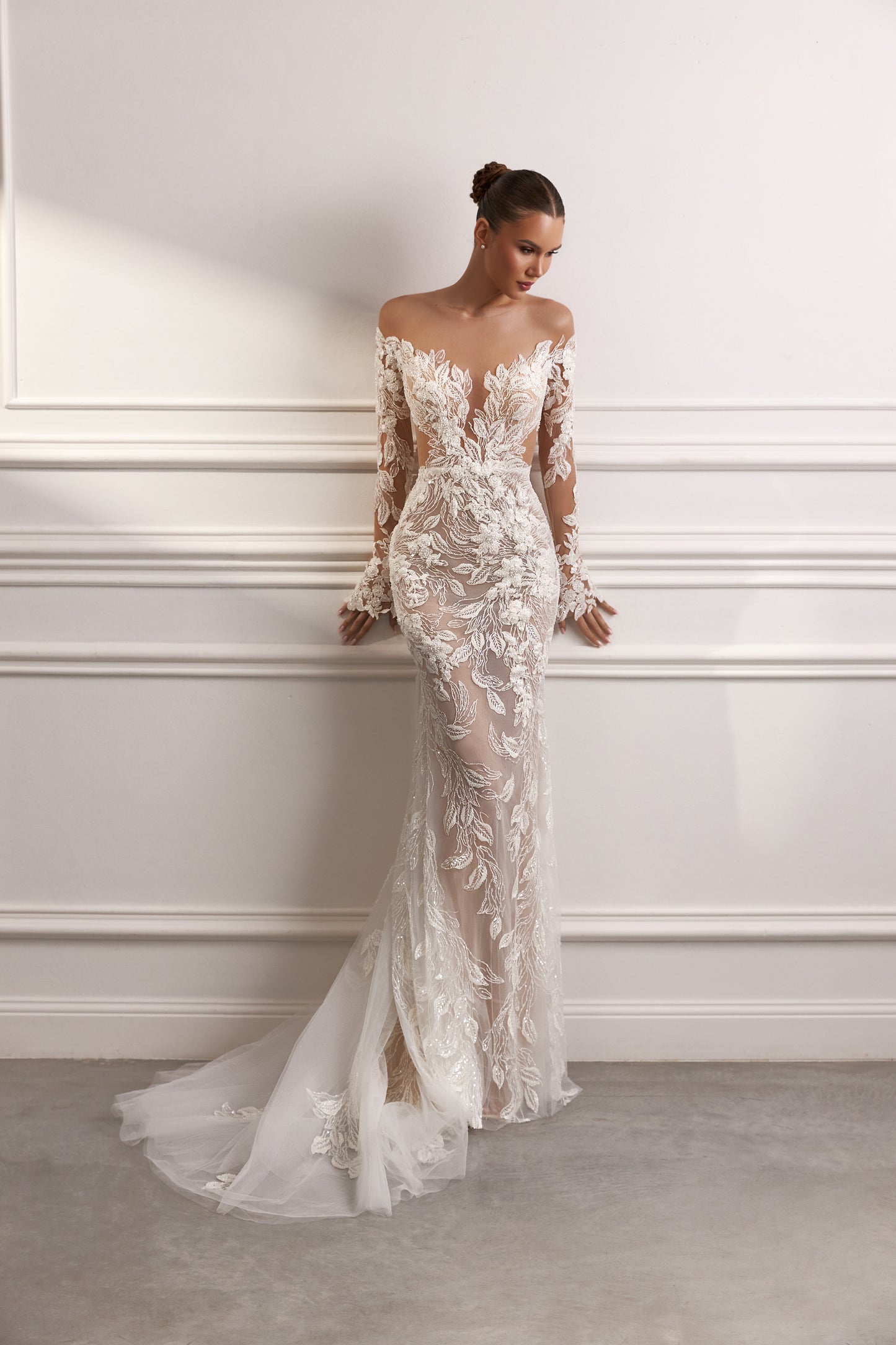 Sheath wedding dress with illusion sleeves and sweep train.