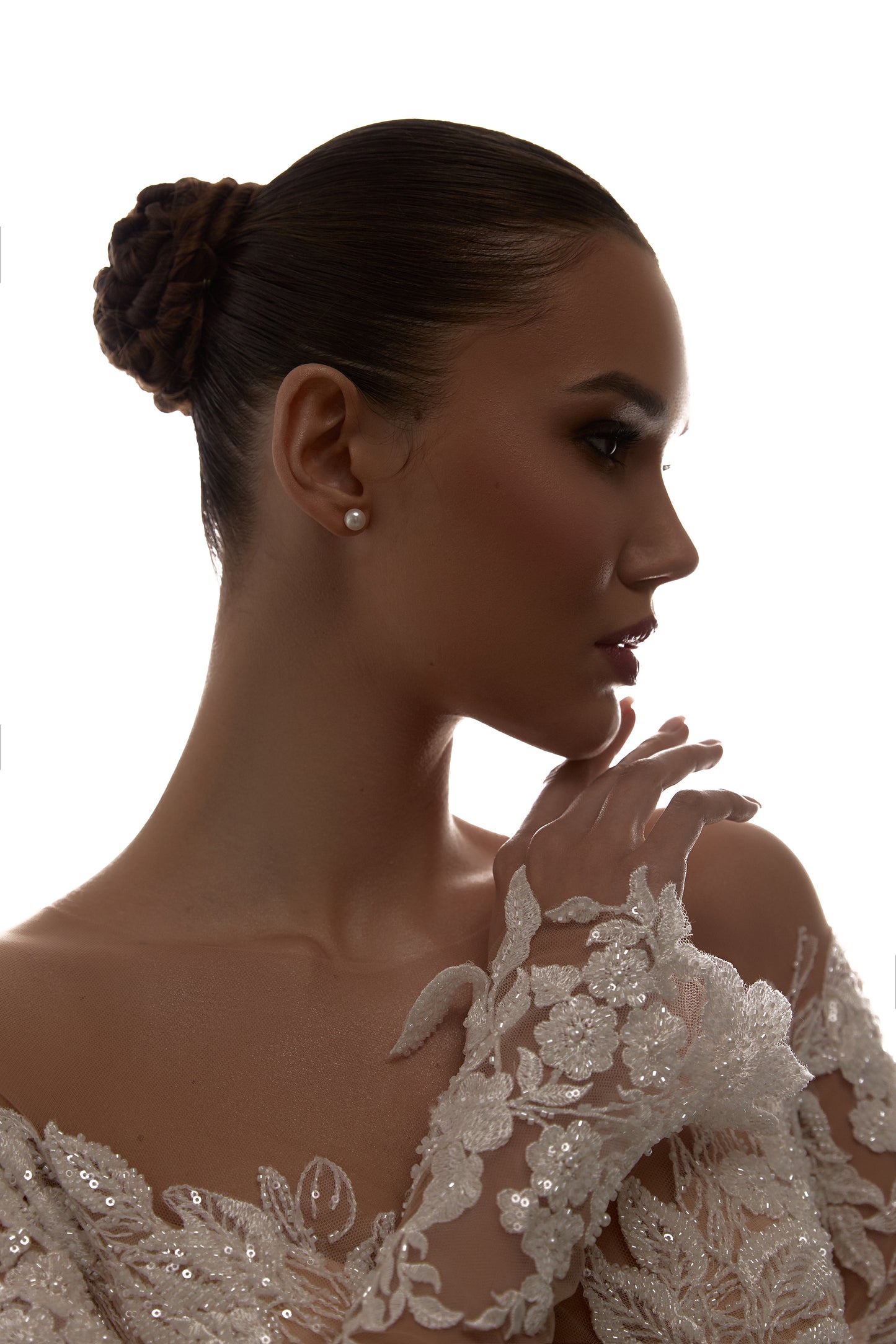 Sheath wedding dress with illusion sleeves and sweep train.