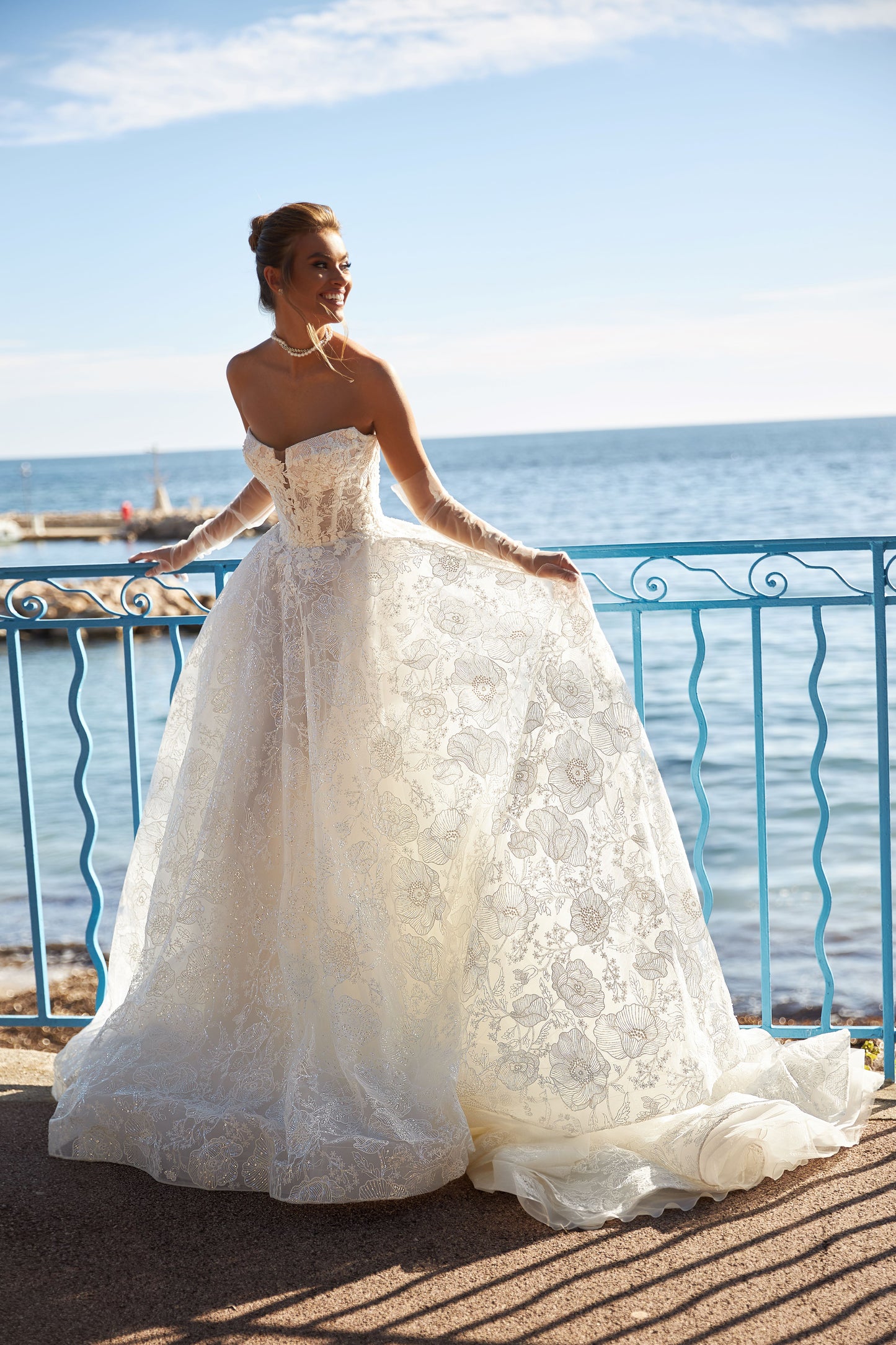 A-line lace wedding dress with chapel train & deep-V neckline.