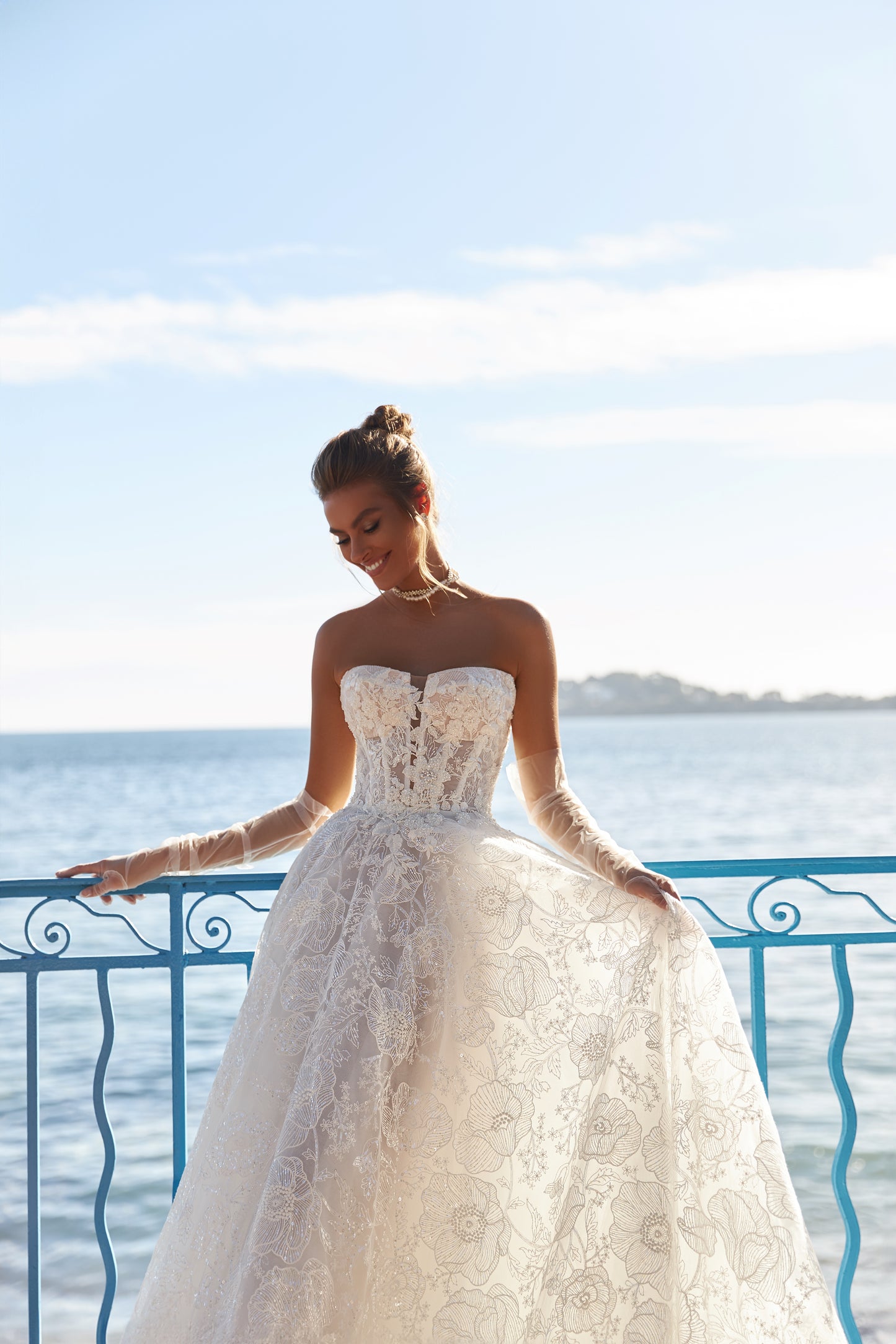 A-line lace wedding dress with chapel train & deep-V neckline.