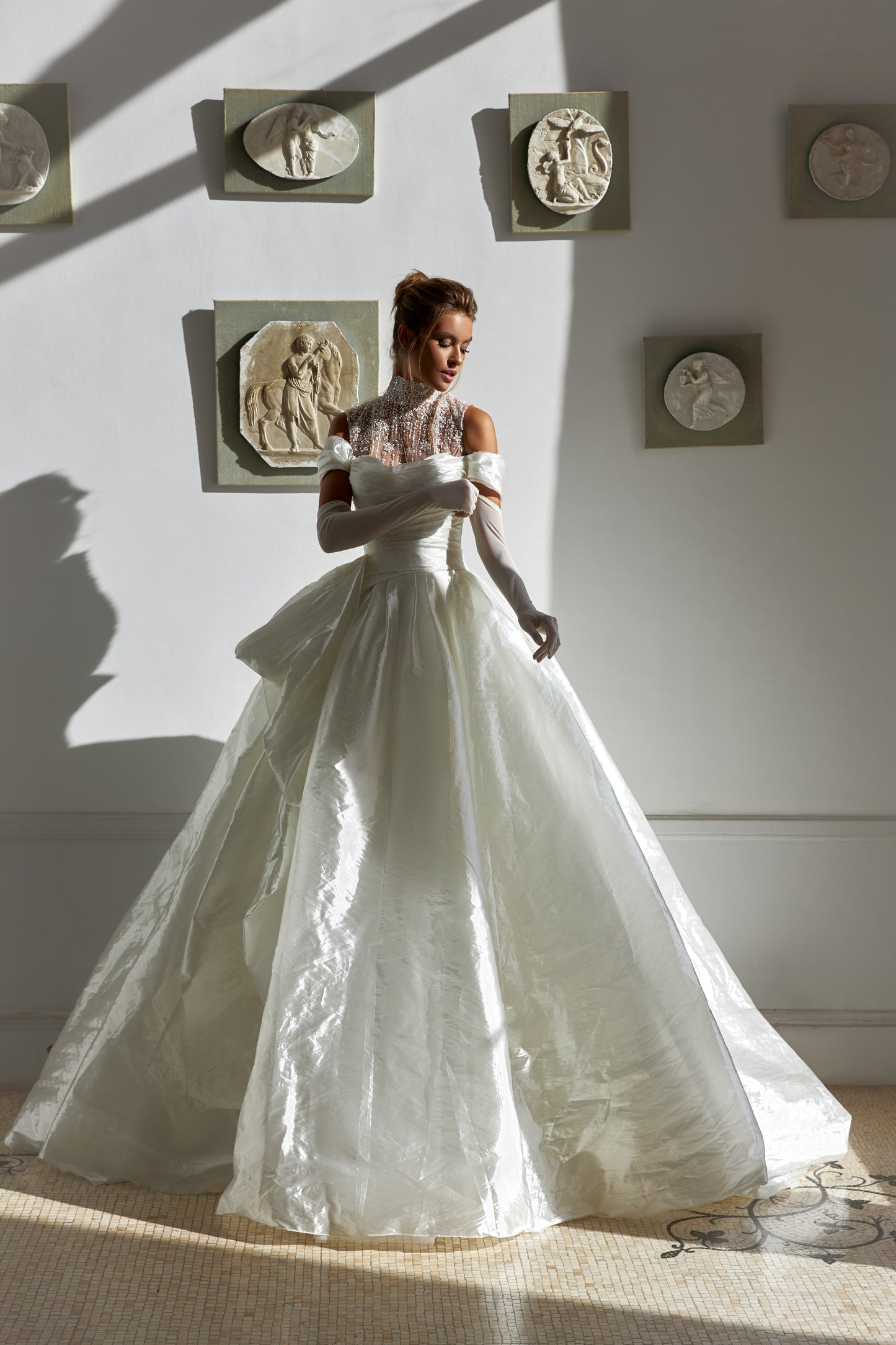 A-line silk wedding dress with off-the-shoulder sleeves