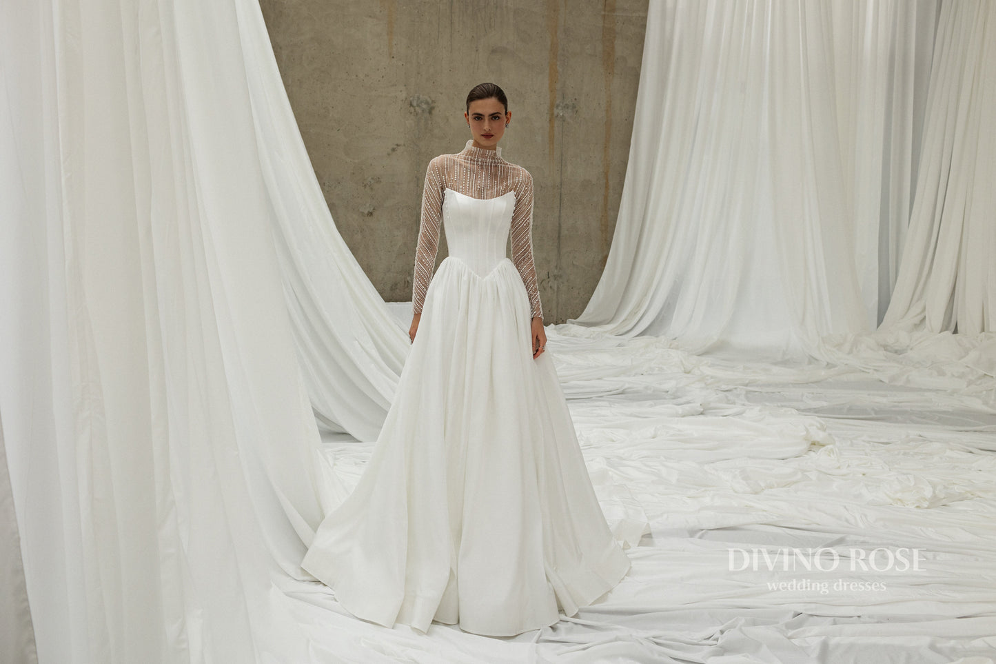A-line wedding dress with illusion sleeves and corset back.