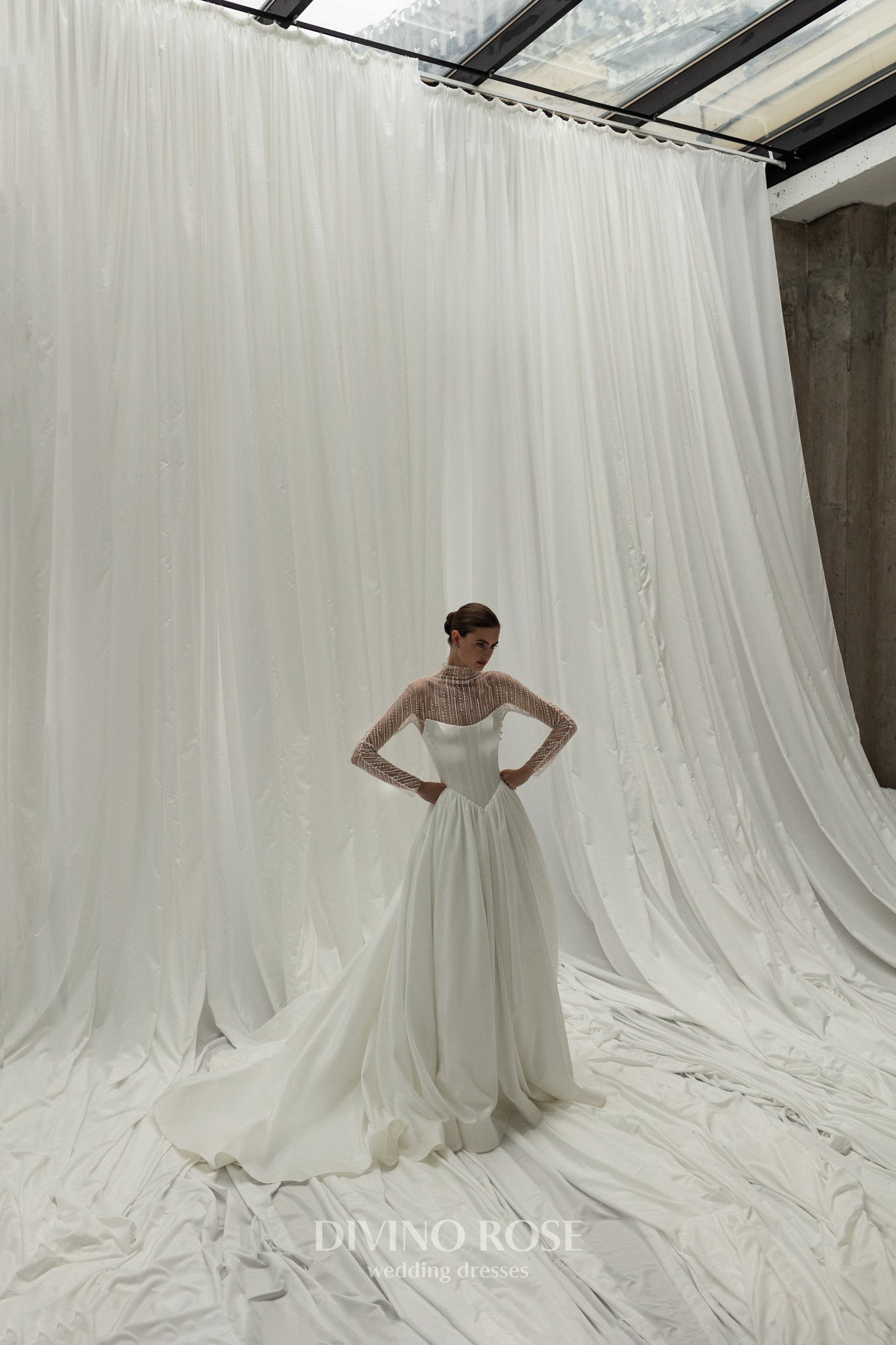 A-line wedding dress with illusion sleeves and corset back.
