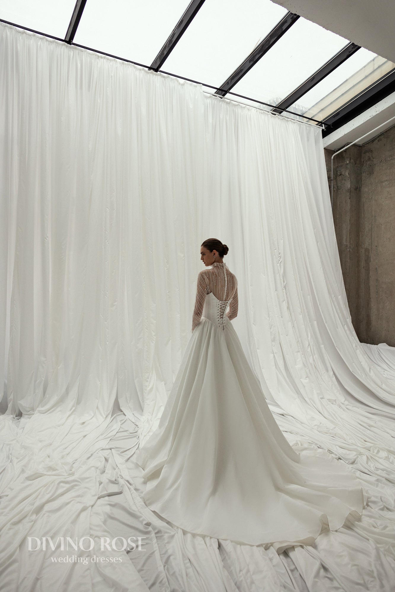 A-line wedding dress with illusion sleeves and corset back.