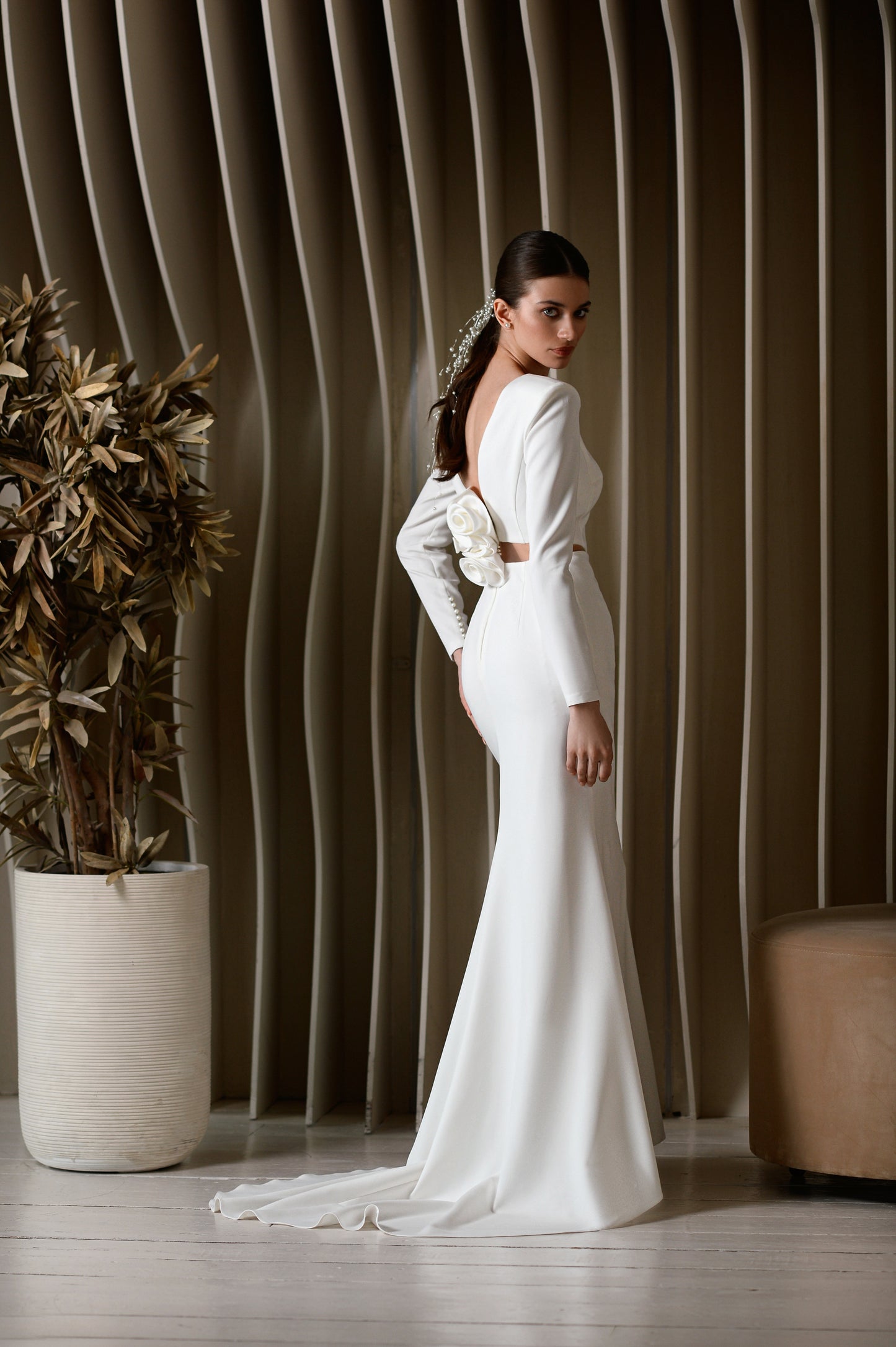Minimalist long sleeve wedding dress with open V back and sweep train