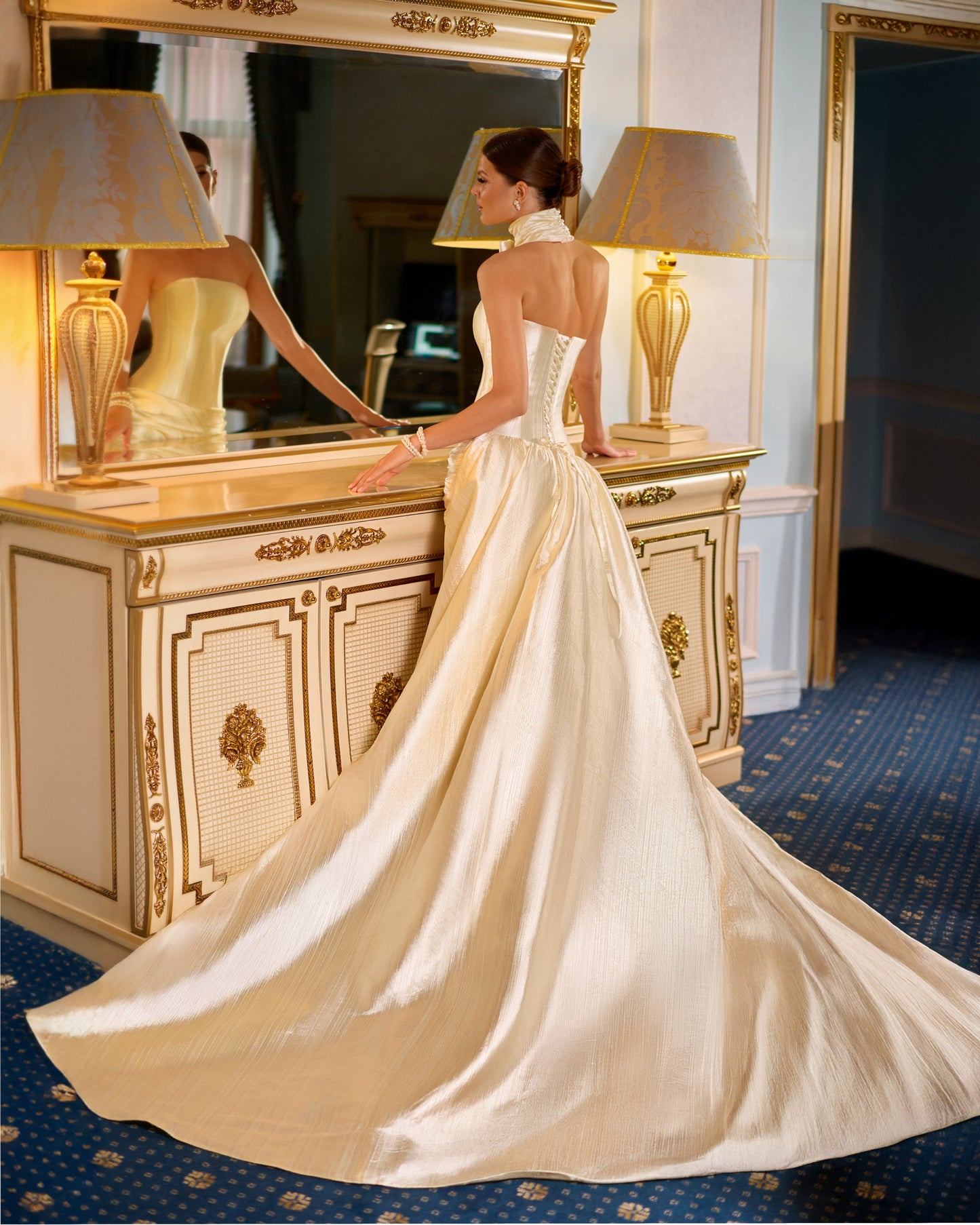 Taffeta fitted mini wedding dress with sleeveless straight neckline, lace-up back closure, draped skirt, and chapel train overskirt for chic modern bridal look