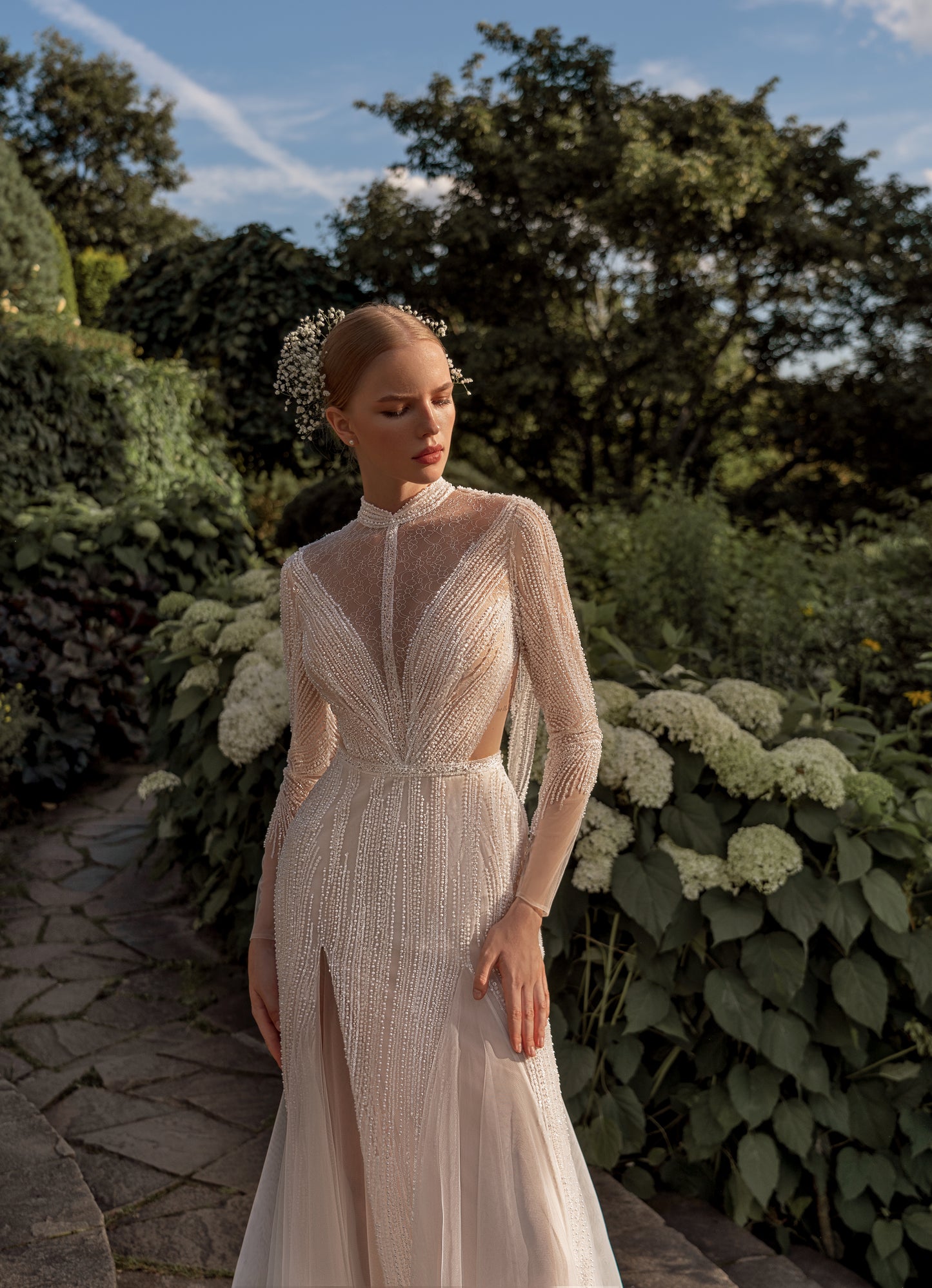 Sheath wedding dress with deep V-neck and open cowl back