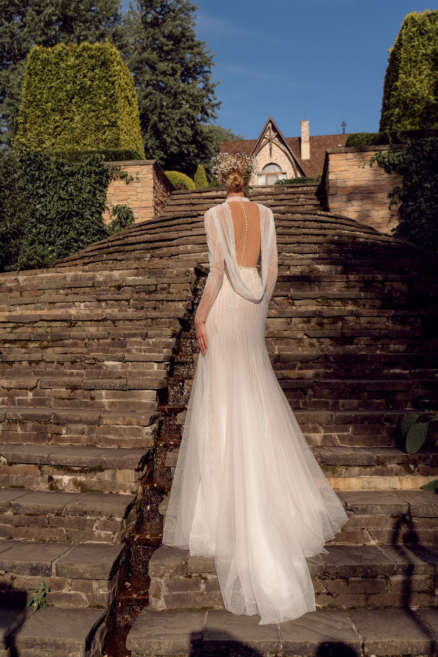 Sheath wedding dress with deep V-neck and open cowl back
