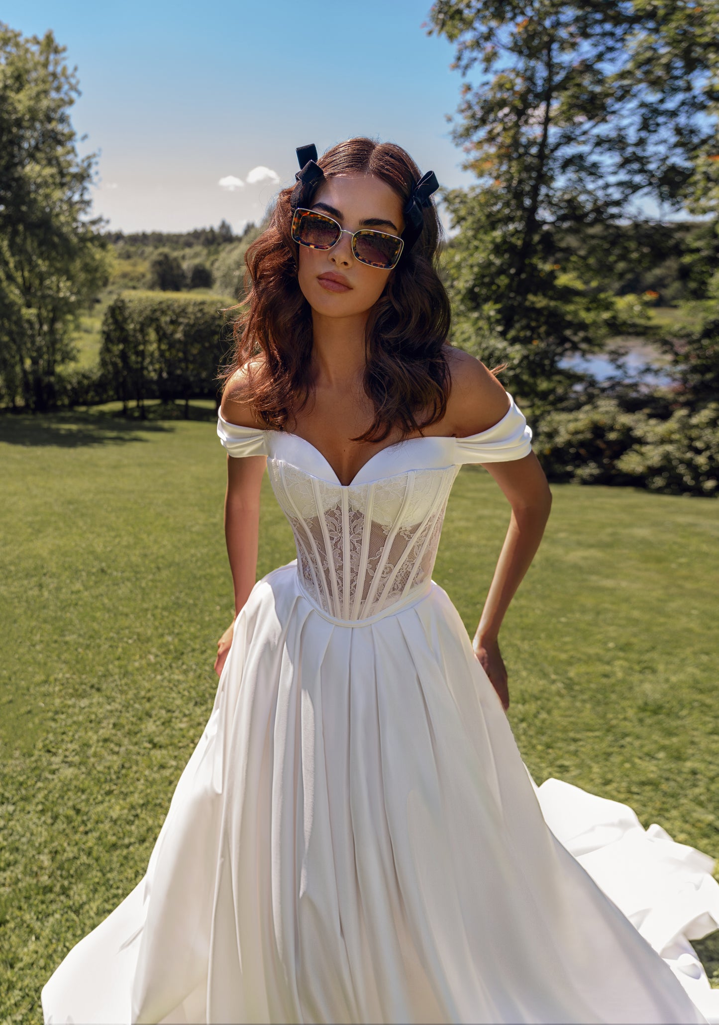 Off-the-shoulder A-line wedding dress with lace-up corset