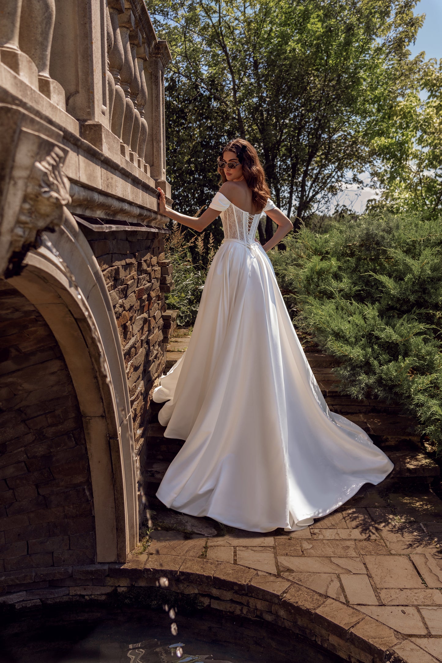 Off-the-shoulder A-line wedding dress with lace-up corset