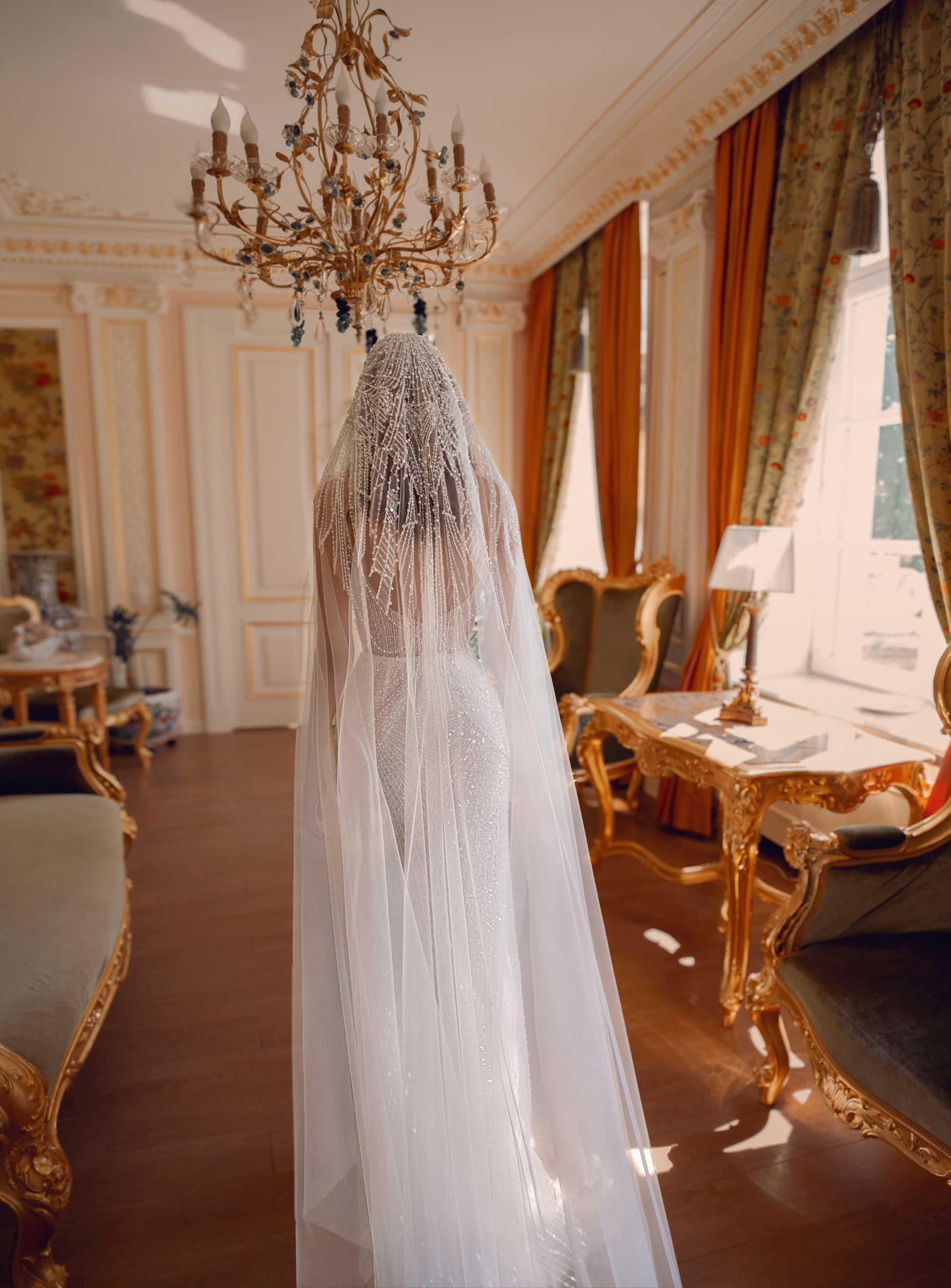Beaded lace corset wedding gown with sweetheart neckline and chapel train, adorned with pearls and sequins.