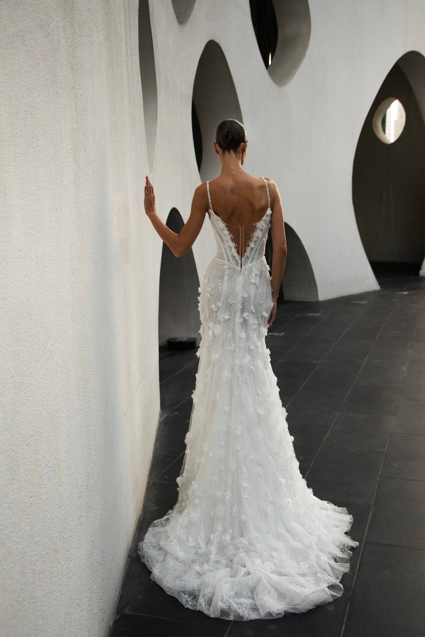 Bride wearing the Capri lace and tulle mermaid wedding gown from the Celeste Collection.