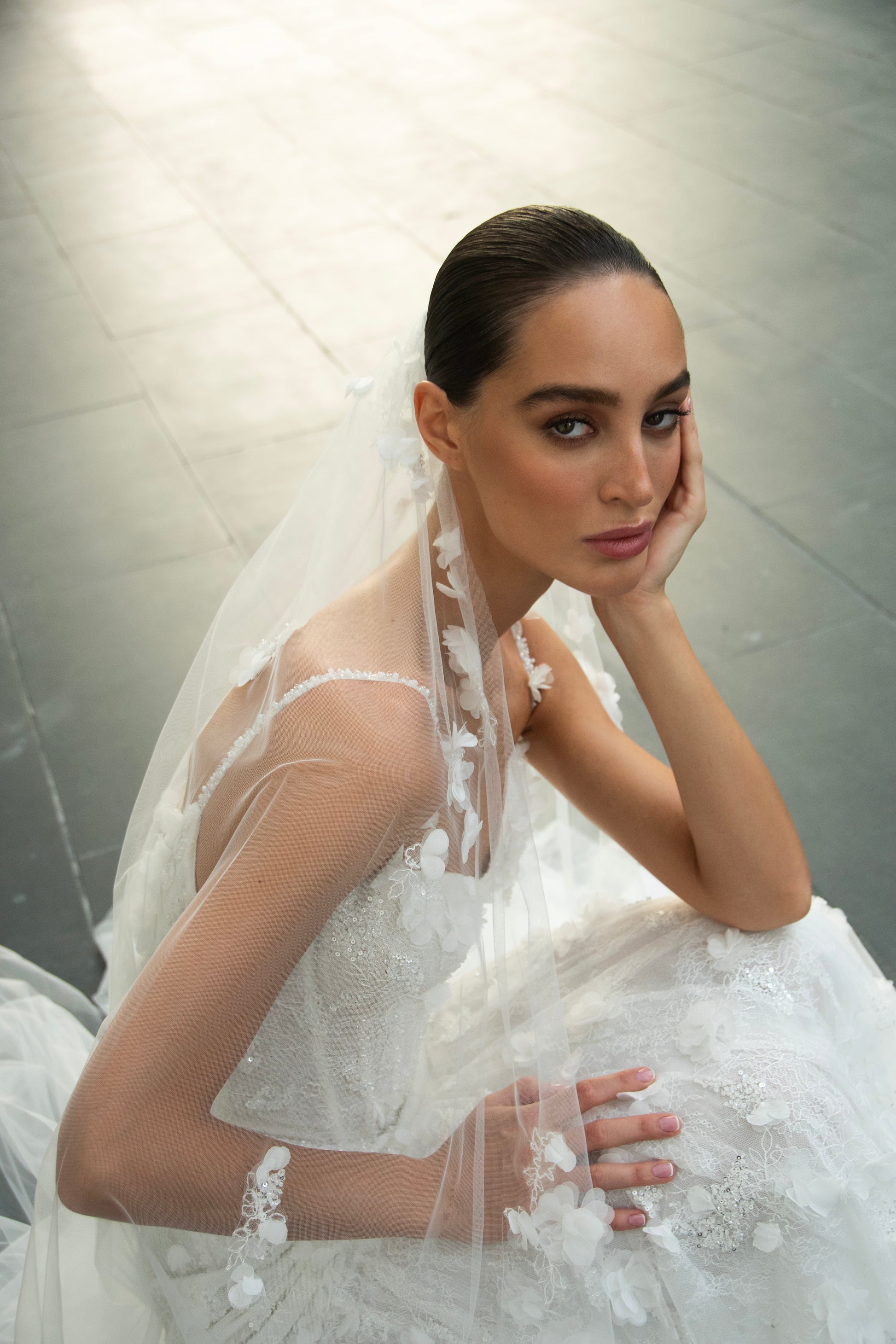 Bride wearing the Capri lace and tulle mermaid wedding gown from the Celeste Collection.