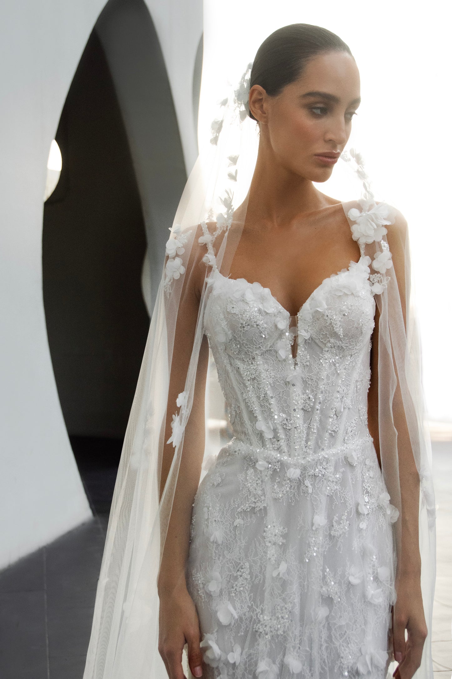 Bride wearing the Capri lace and tulle mermaid wedding gown from the Celeste Collection.